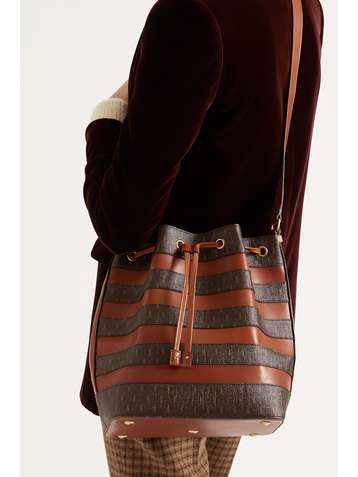SAINT LAURENT Sac seau en toile enduite imprimée à empiècements en cuir Le Monogramme