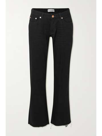 BALENCIAGA Distressed low-rise flared jeans