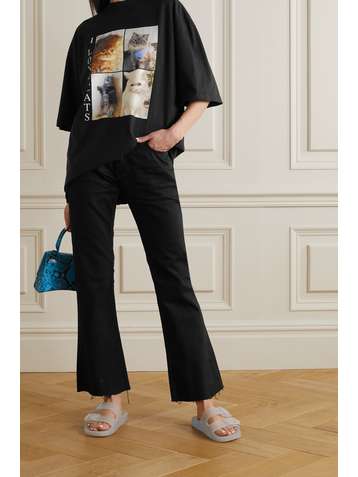 BALENCIAGA Distressed low-rise flared jeans