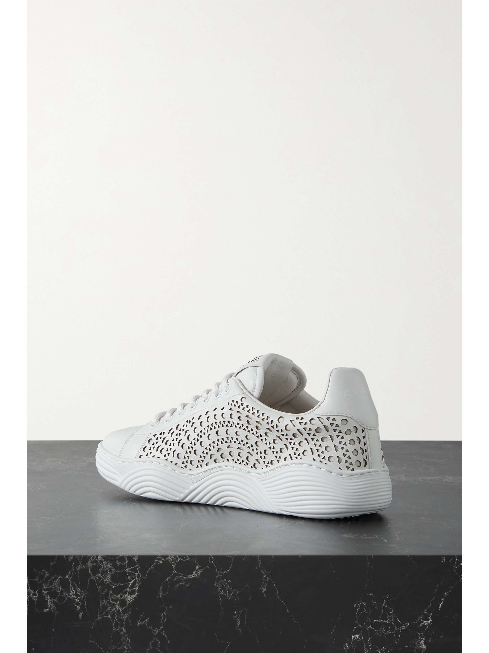 ALAÏA Laser-cut leather sneakers
