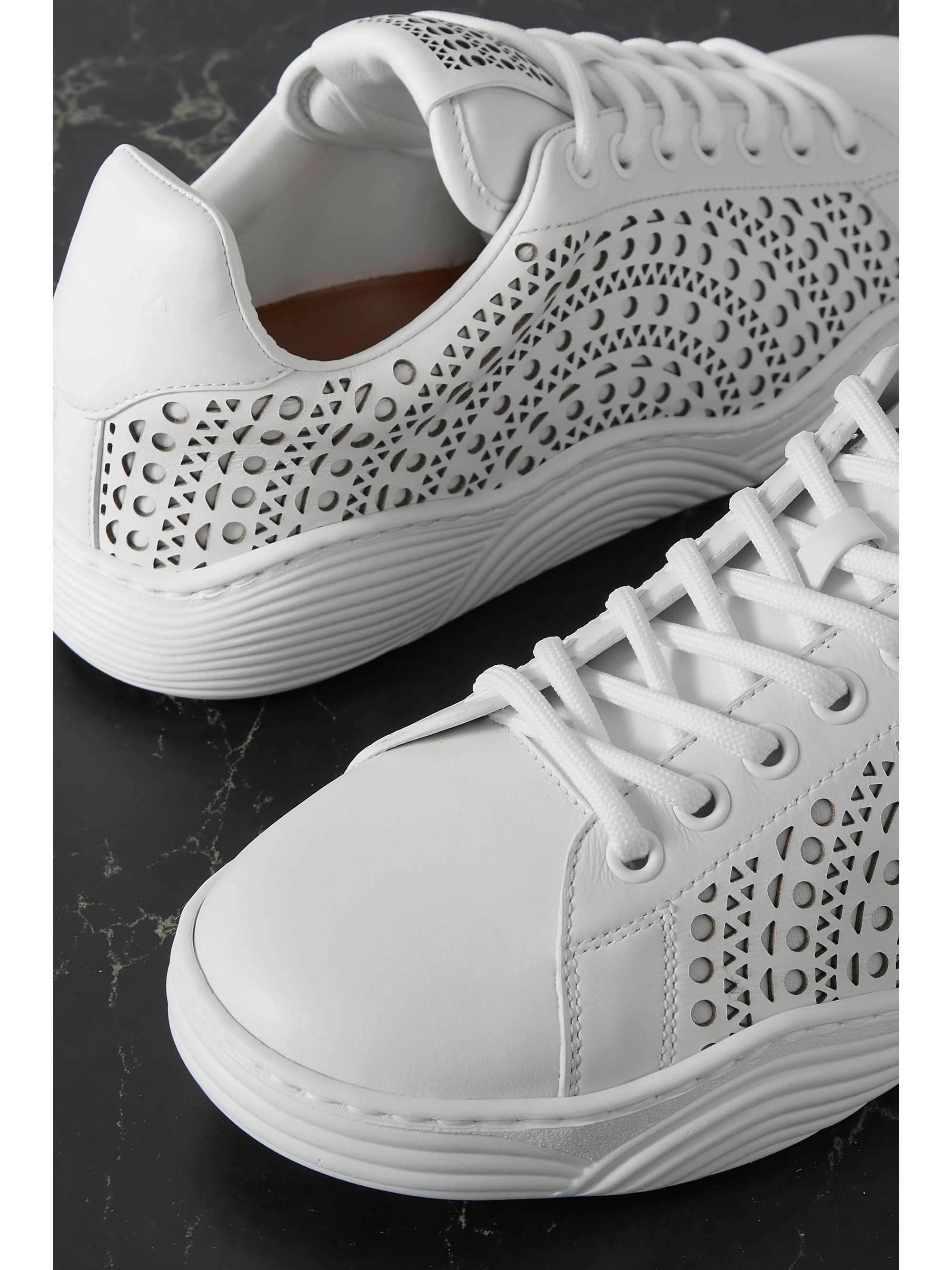 ALAÏA Laser-cut leather sneakers