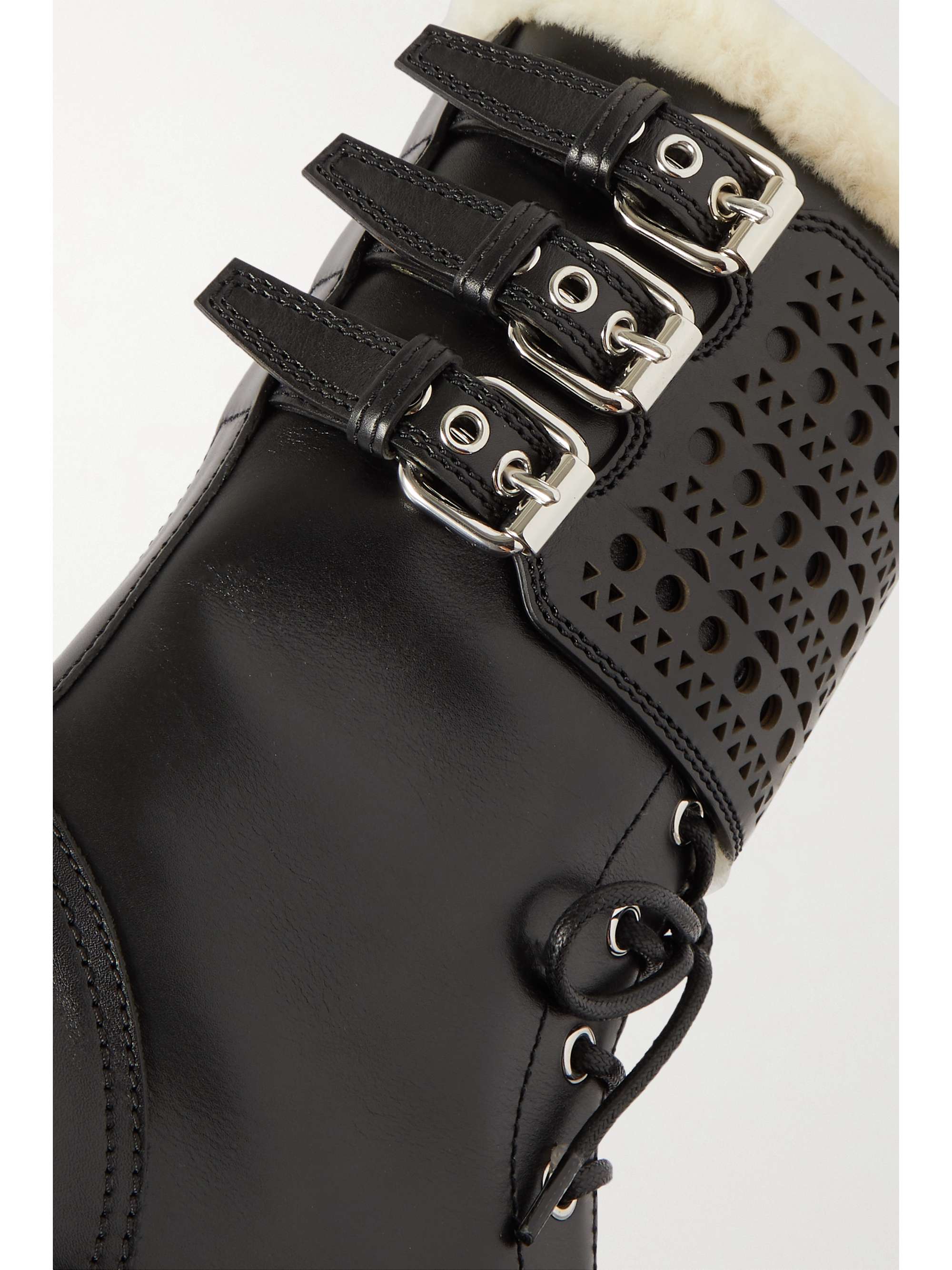 ALAÏA 50 shearling-lined laser-cut leather ankle boots