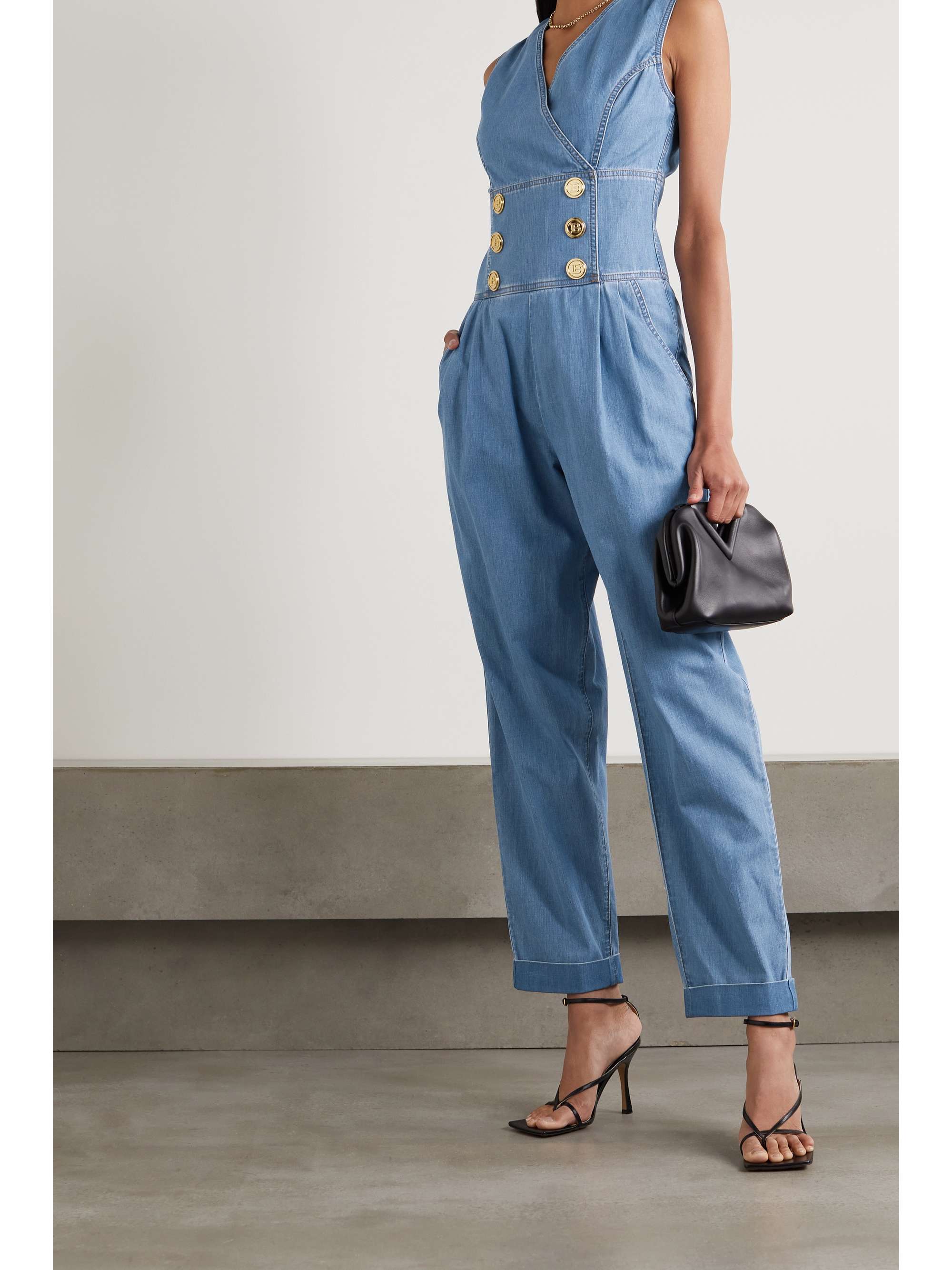 BALMAIN Button-embellished denim jumpsuit | NET-A-PORTER