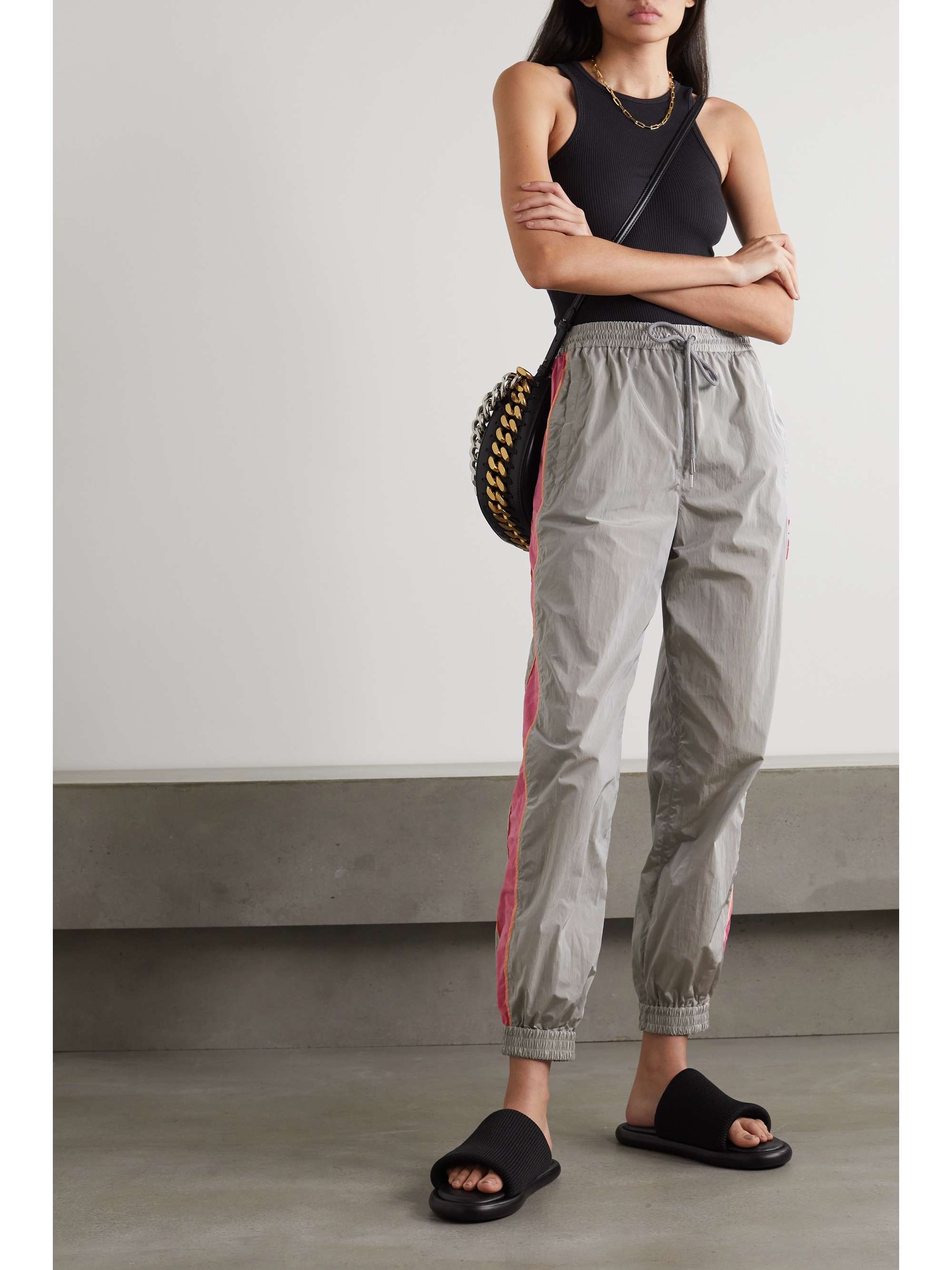 STELLA MCCARTNEY Kira appliquéd striped ECONYL track pants