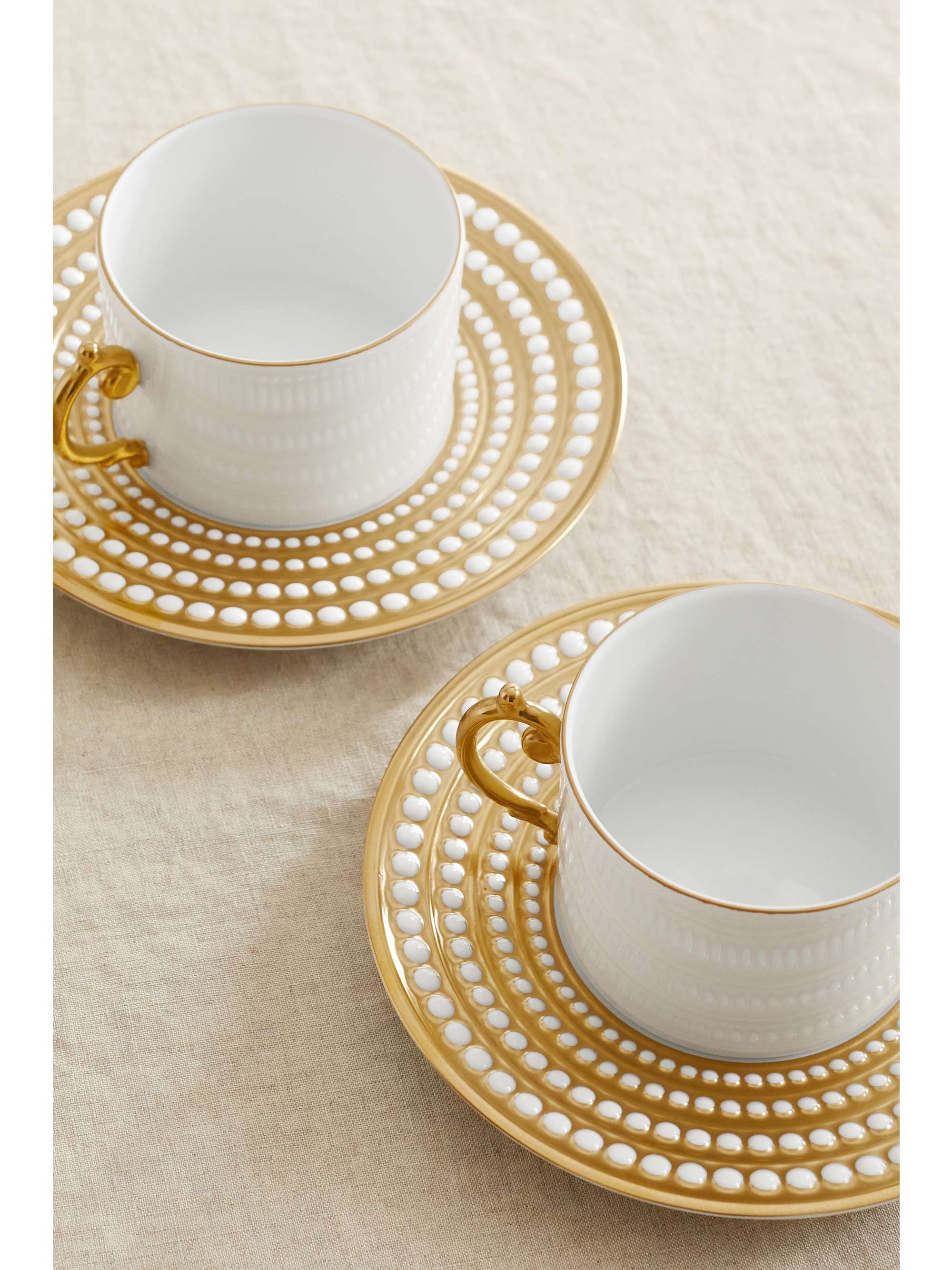 L'OBJET Perlée set of two gold-plated porcelain teacup and saucers