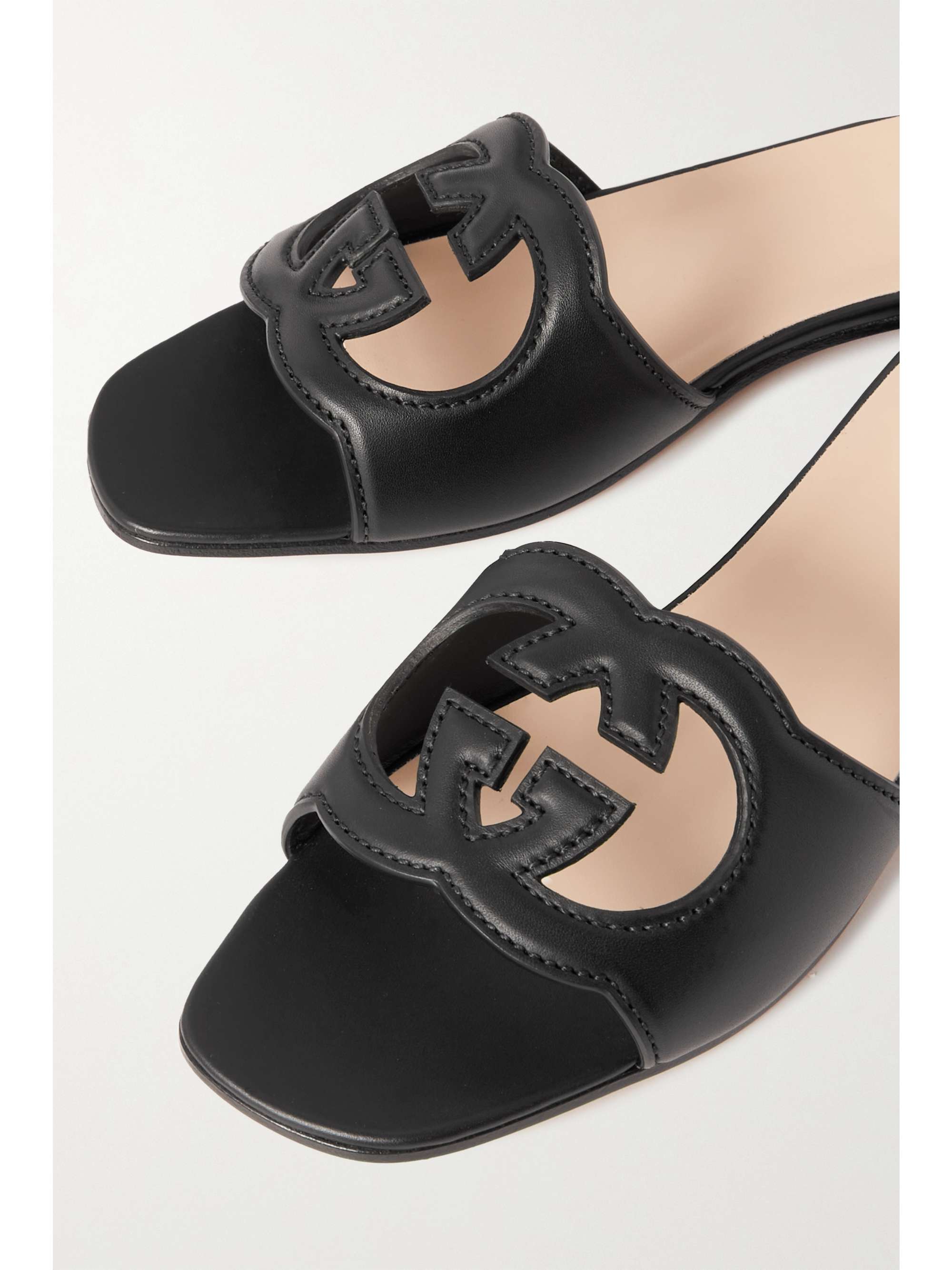 GUCCI Cutout leather slides NETAPORTER