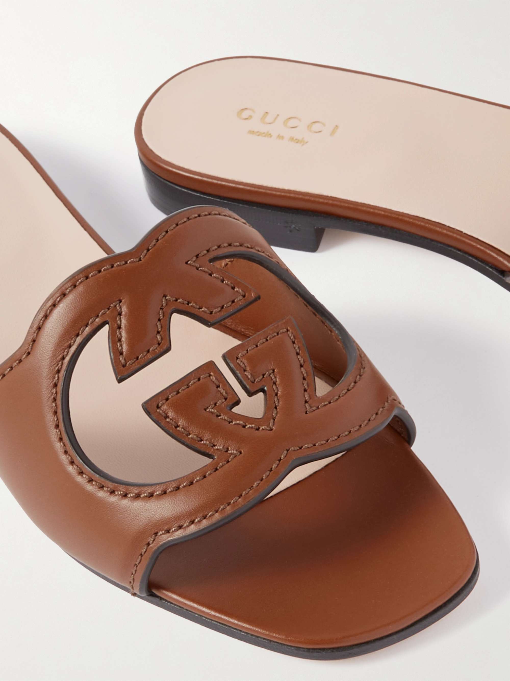 GUCCI Cutout leather slides NETAPORTER