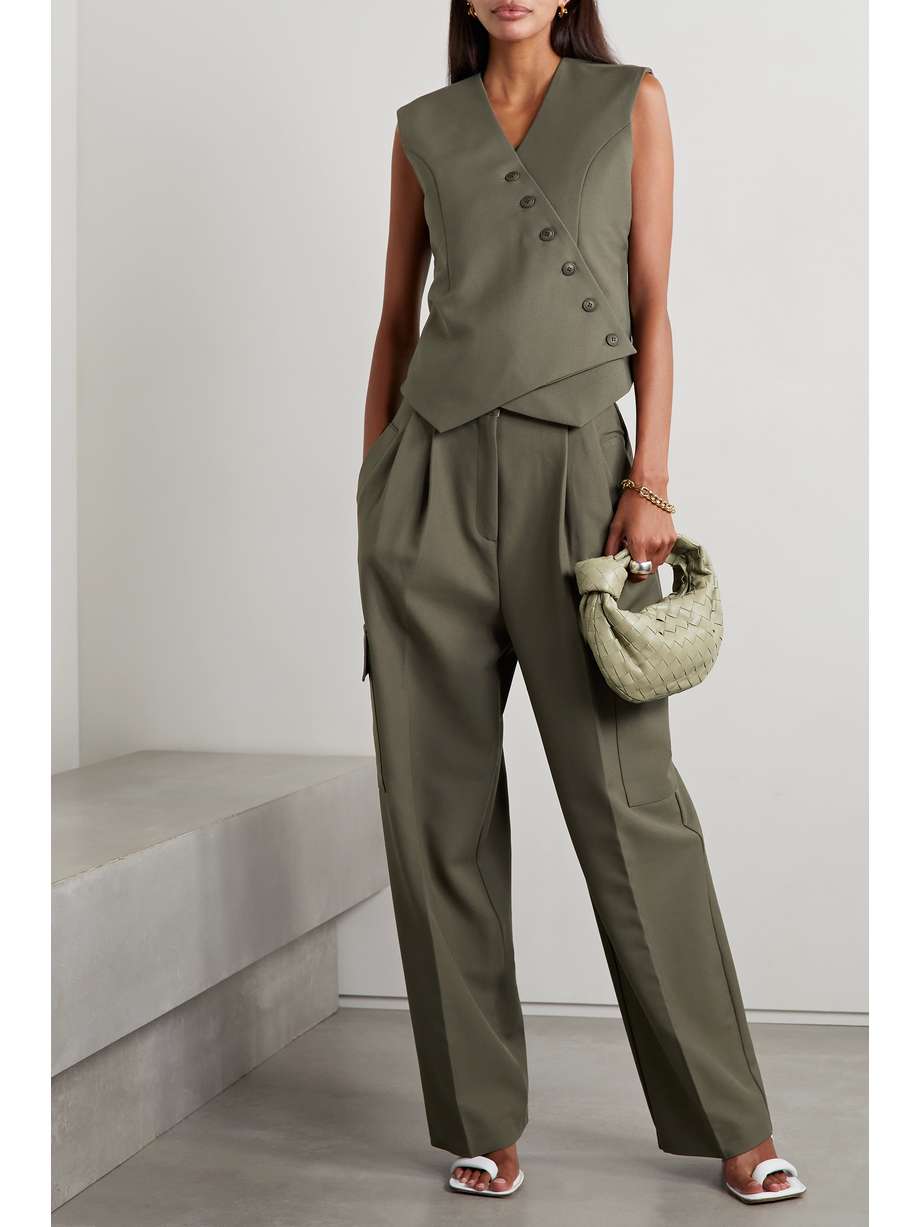 A hybrid of tailored and cargo styles, Frankie Shop's woven 'Maesa' pants feel at once polished and relaxed. They have sharply pressed pleats running from the high-rise waist through the wide legs. The versatile army-green shade will complement muted neutrals and bold pops of color alike.