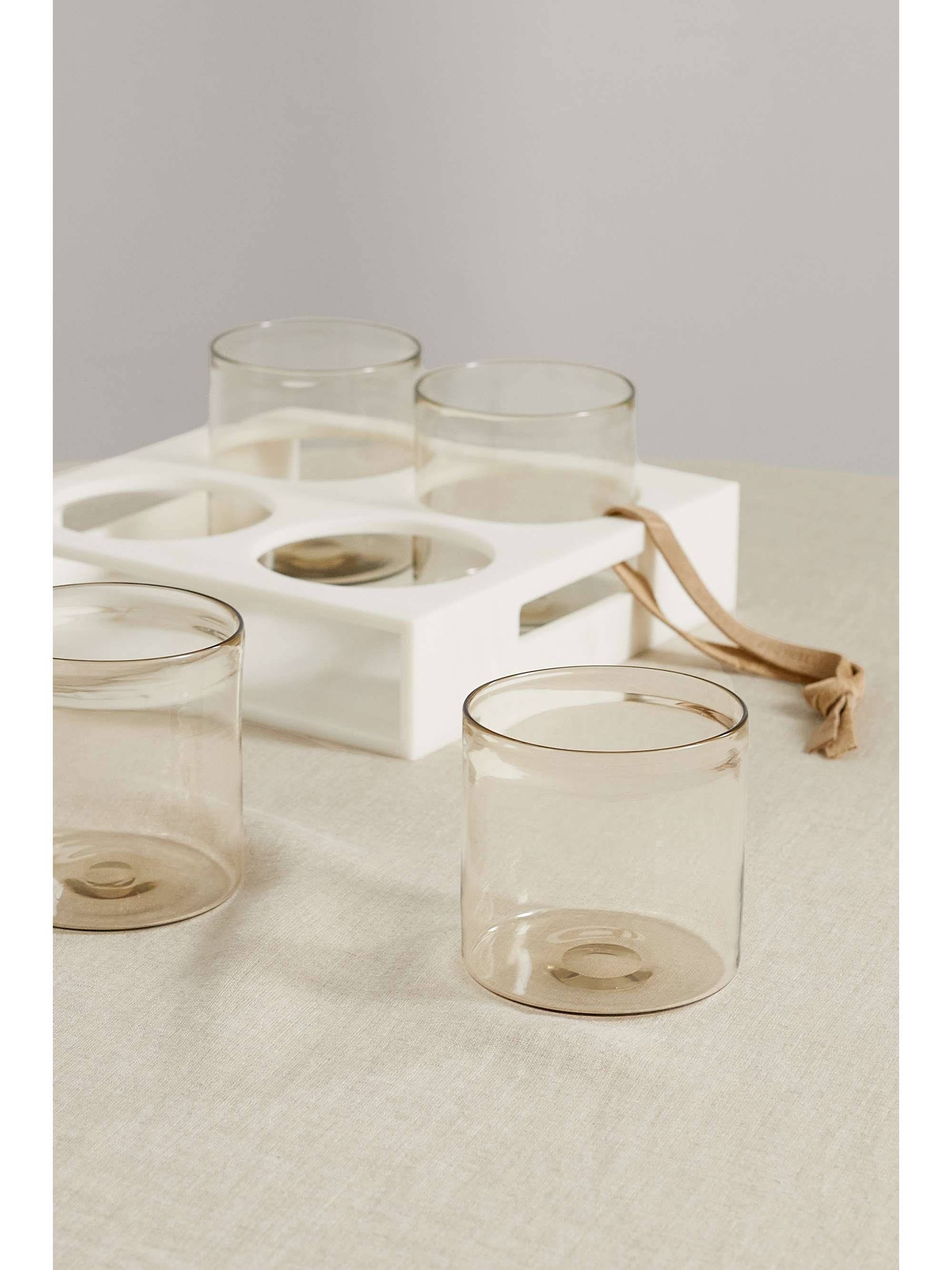 BRUNELLO CUCINELLI Set of four glass tumblers with Krion holder