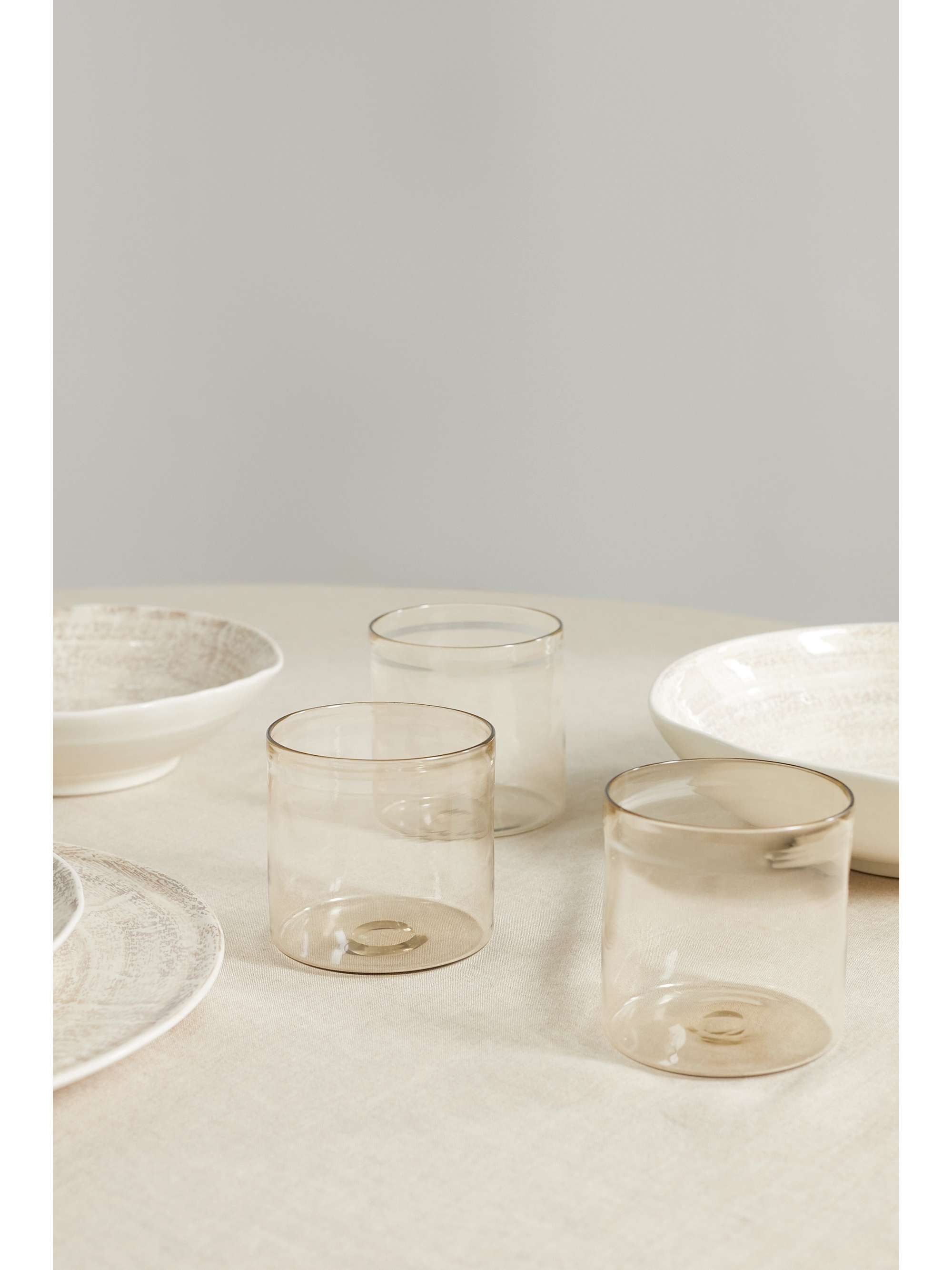 BRUNELLO CUCINELLI Set of four glass tumblers with Krion holder