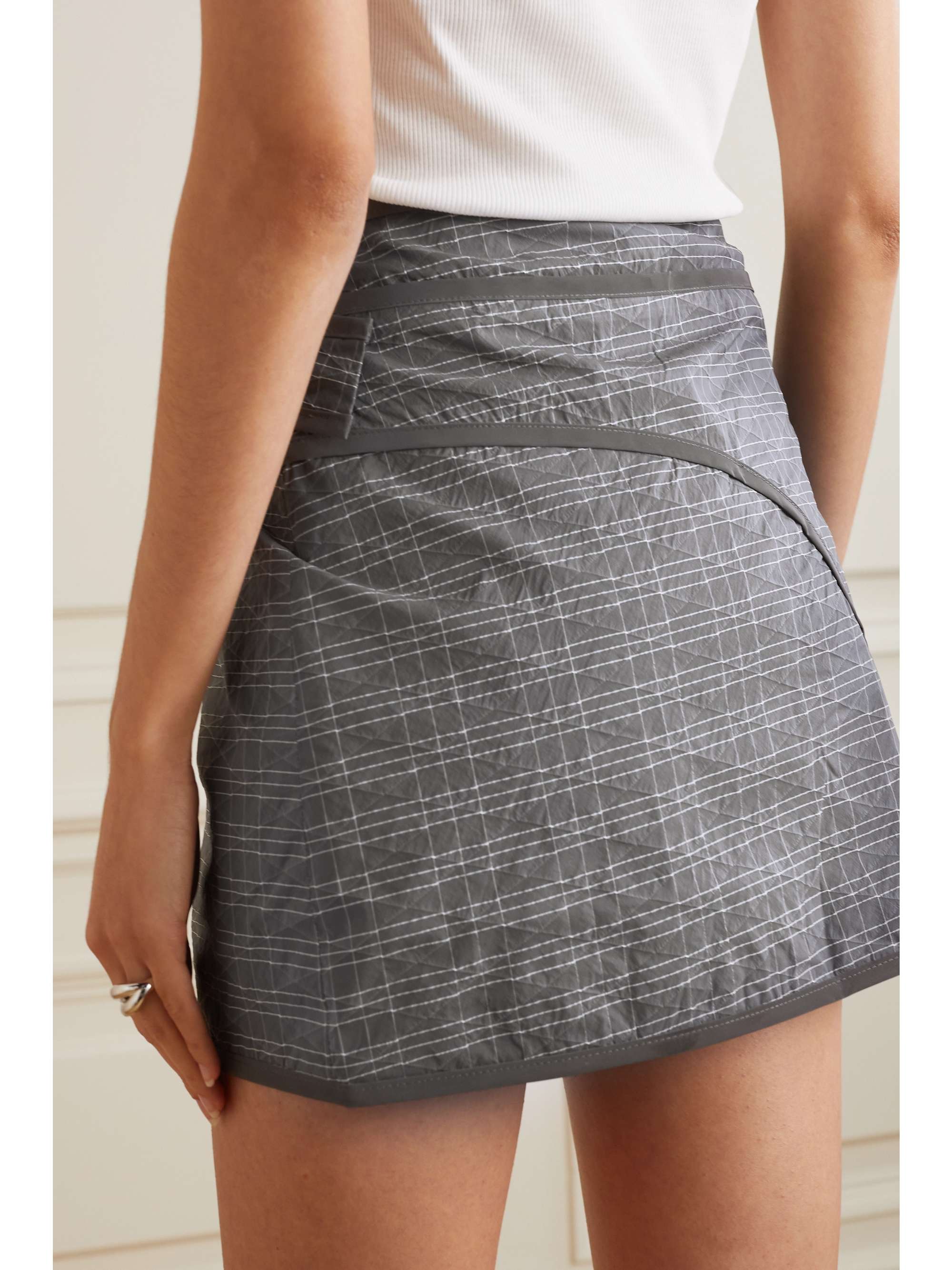 MCQ ALEXANDER MCQUEEN Long Now matelassé checked shell mini wrap skirt