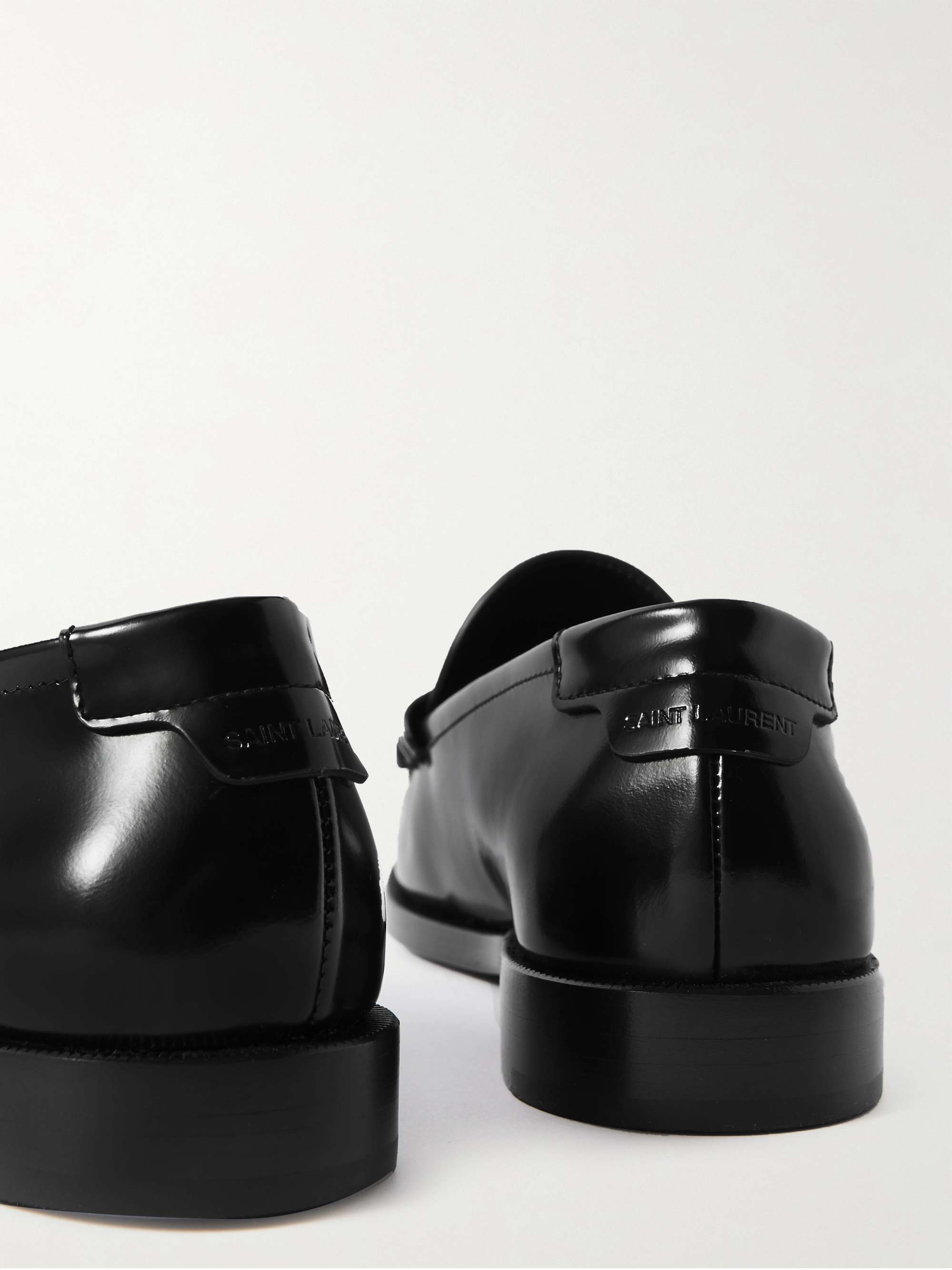 SAINT LAURENT Glossed-leather loafers