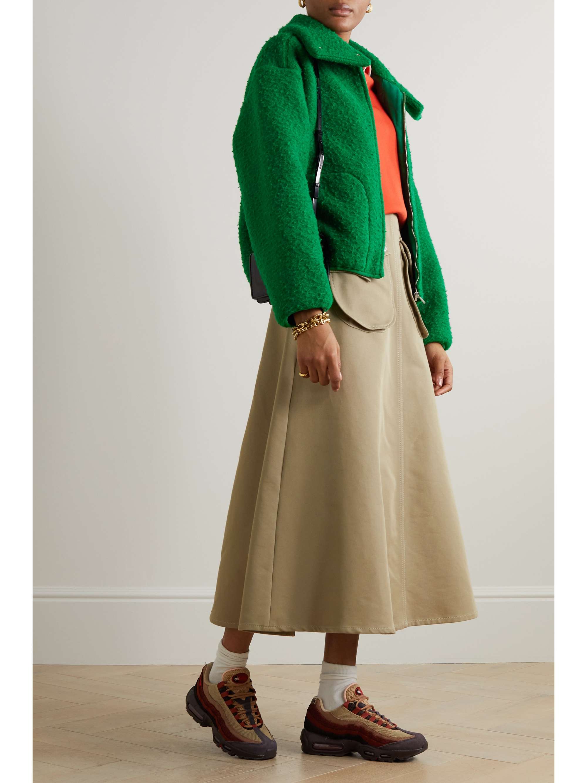 Designed in collaboration with creative duo Emili Sindlev and Mads Emil Grove Møller, Holzweiler's forest-green wool-blend fleece jacket is both cozy and cool. It has a zipped front with snap fastenings at the funnel neck to help lock in warmth. Pair yours with flared pants and chunky boots.
