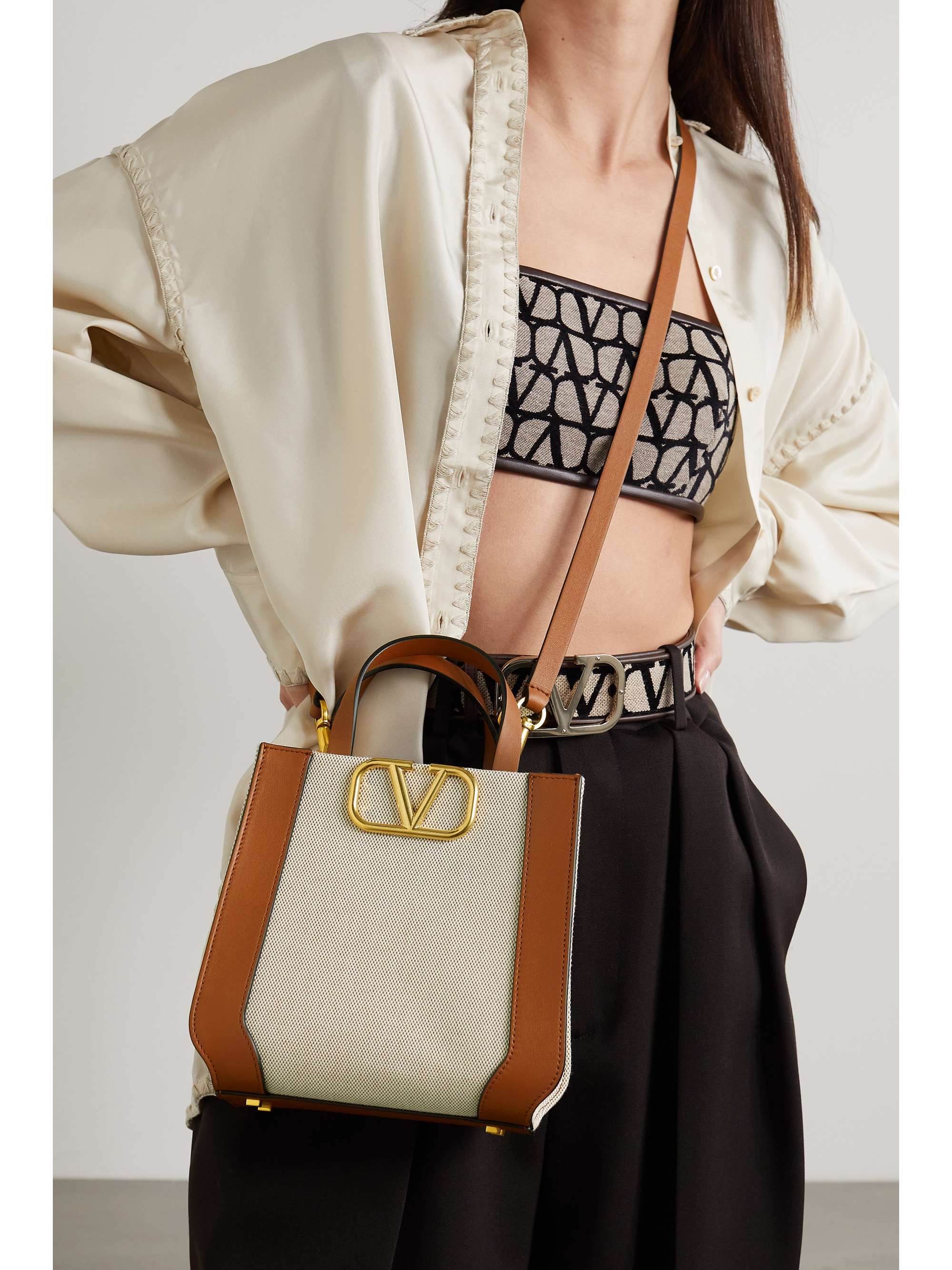 VALENTINO GARAVANI Valentino Garavani VLOGO leather-trimmed canvas shoulder bag
