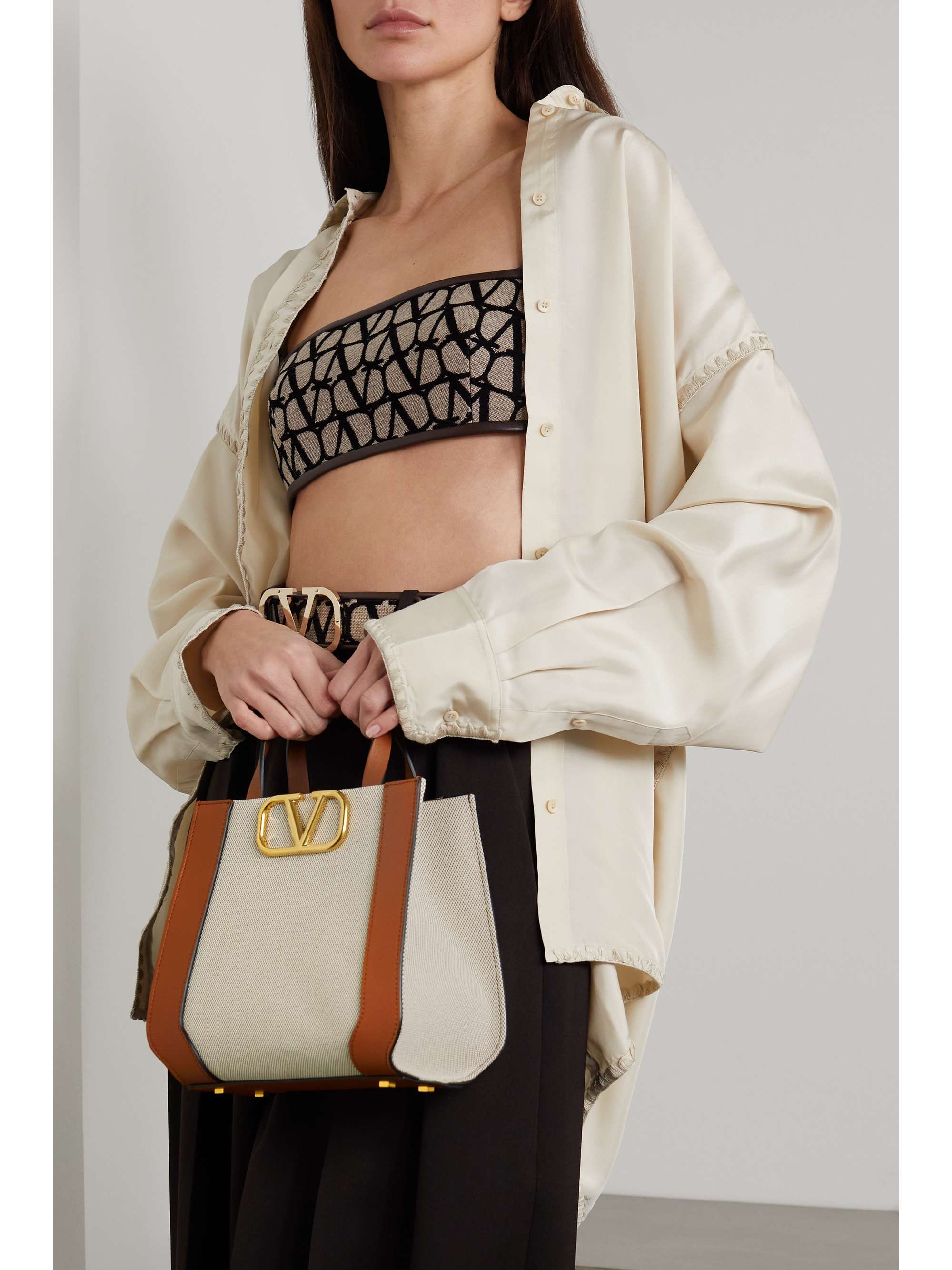 VALENTINO GARAVANI Valentino Garavani VLOGO leather-trimmed canvas shoulder bag