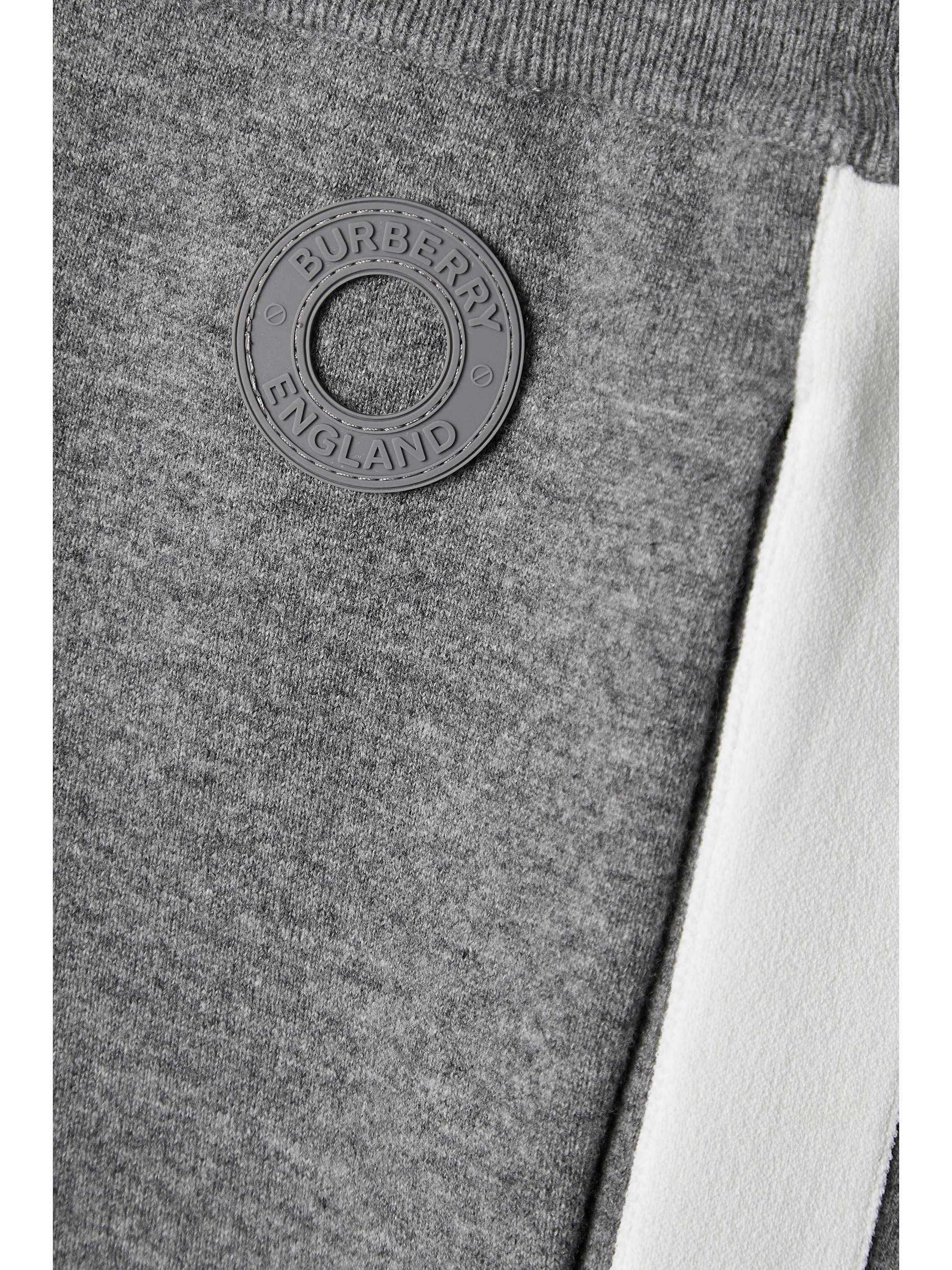 BURBERRY Appliquéd paneled knitted tapered track pants