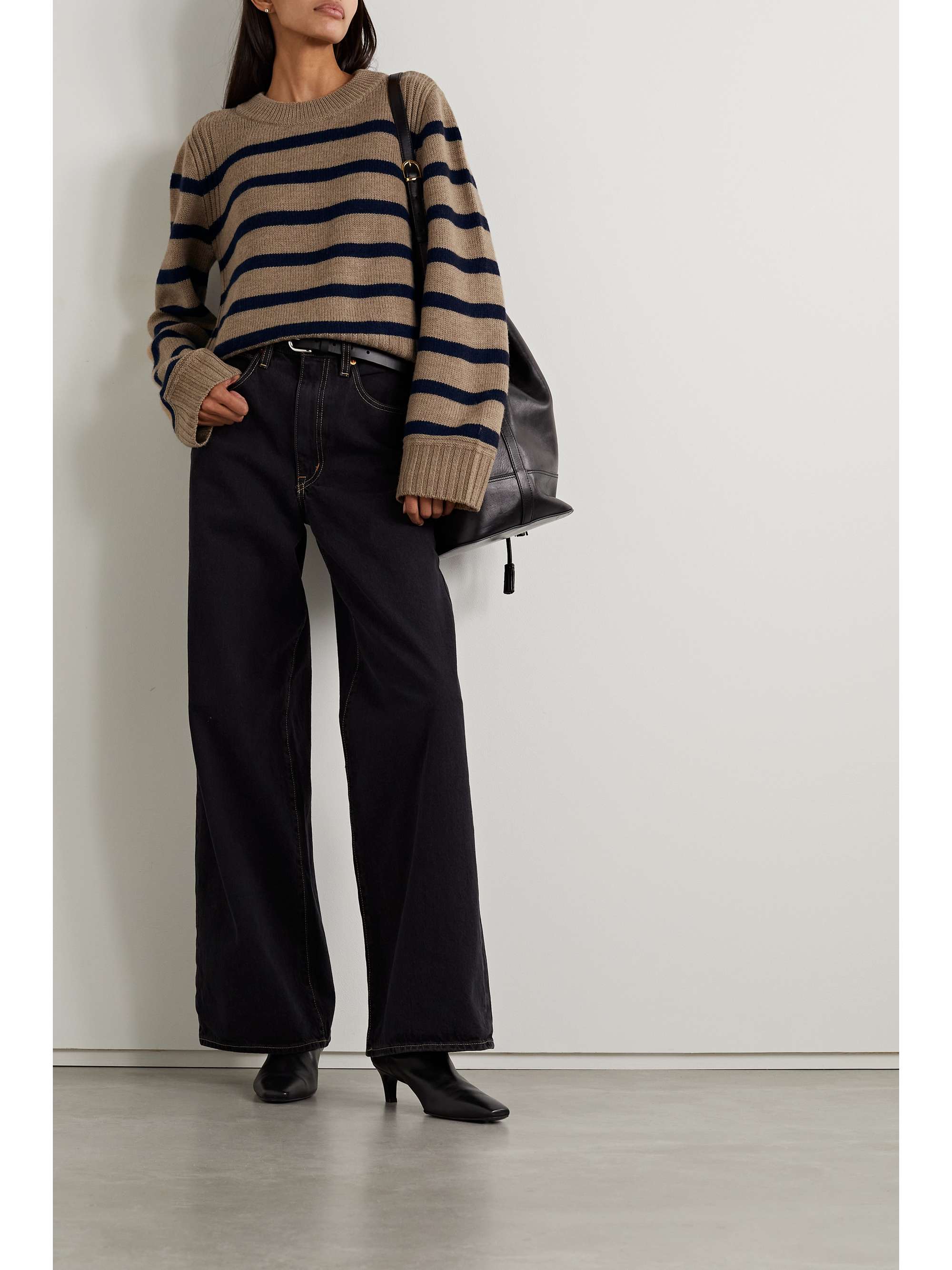 Chic striped sweater outfit with black wide-leg jeans