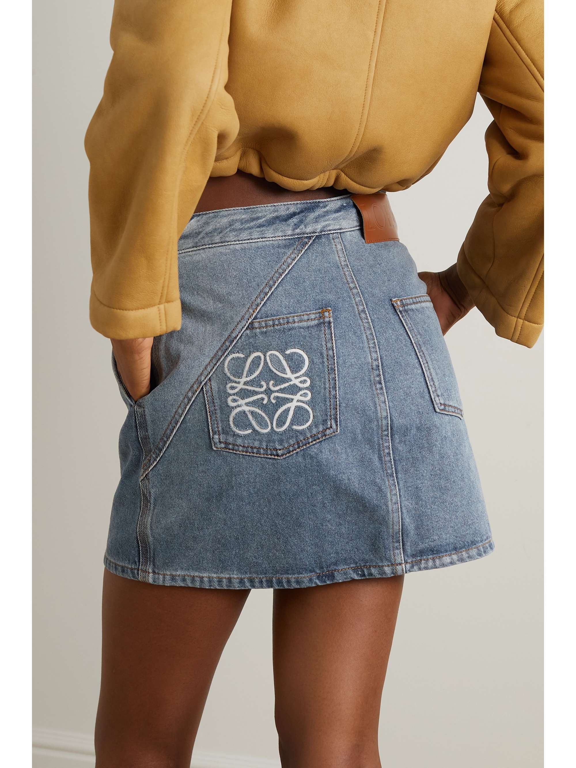 LOEWE Anagram asymmetric leather-trimmed denim mini skirt