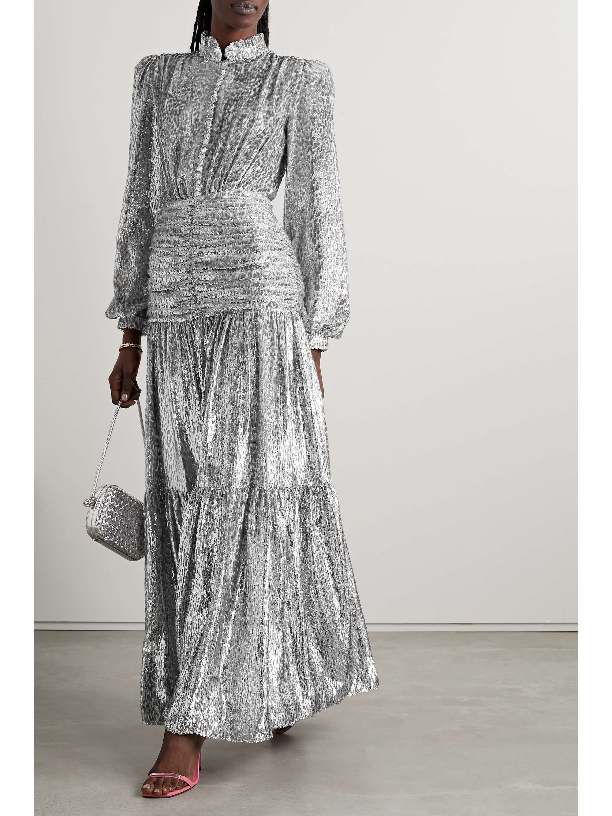 Costarellos' gown combines high-octane glamour with Victorian elements, like billowy sleeves and a ruffled neckline. Made from metallic fil coupé chiffon that catches the light from every angle, it has a ruched panel at the hips and falls to a tiered skirt that moves beautifully as you walk