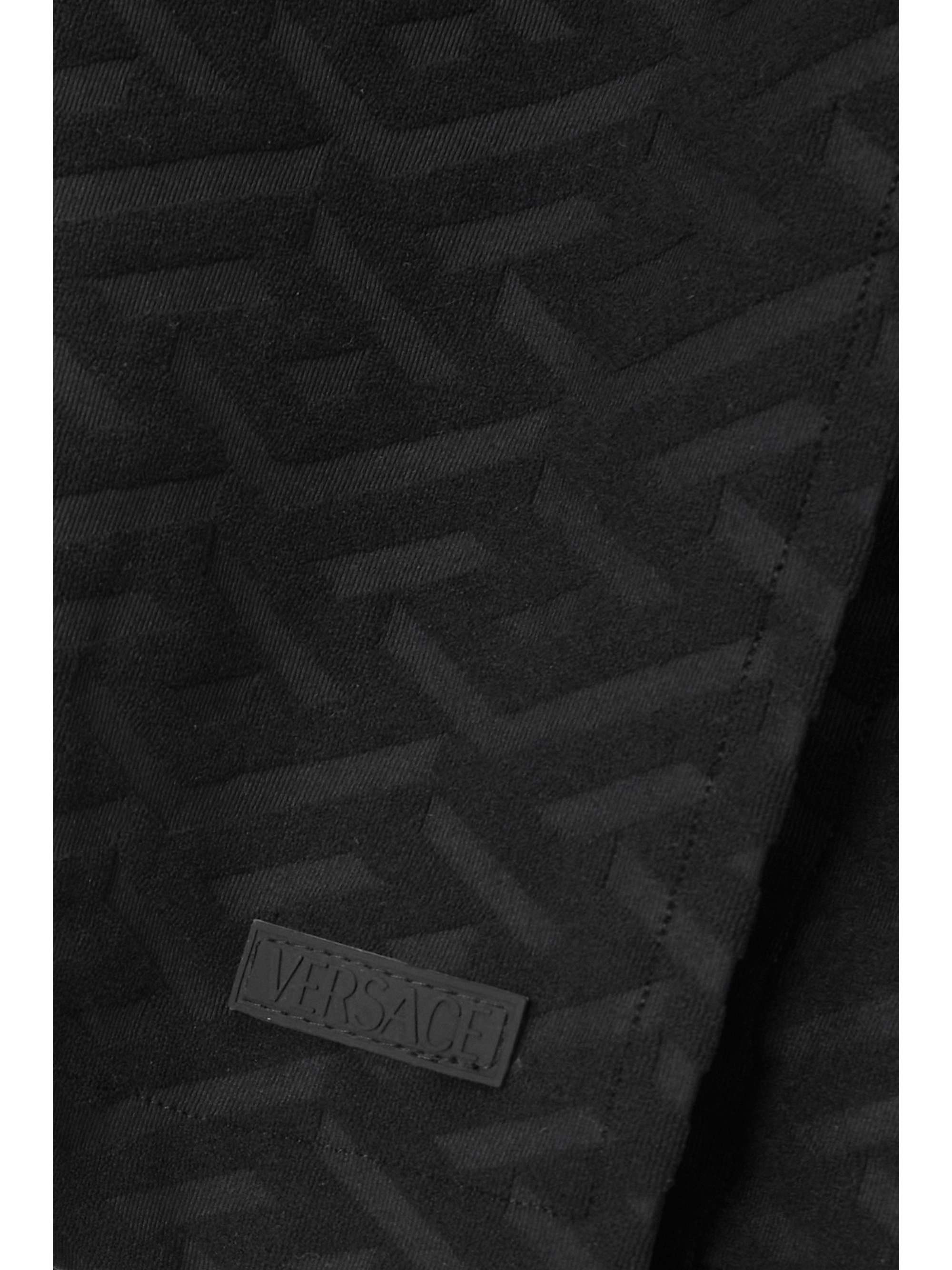 VERSACE La Greca embossed stretch-terry mini skirt