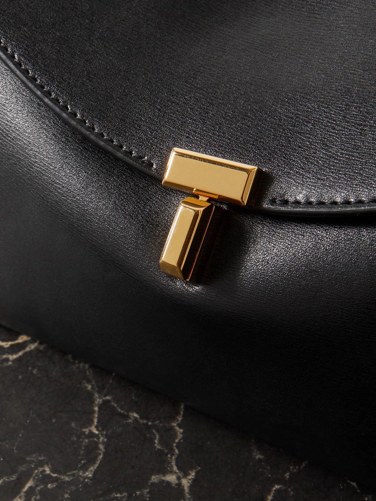 Shop Totême T-lock Leather Clutch In Black