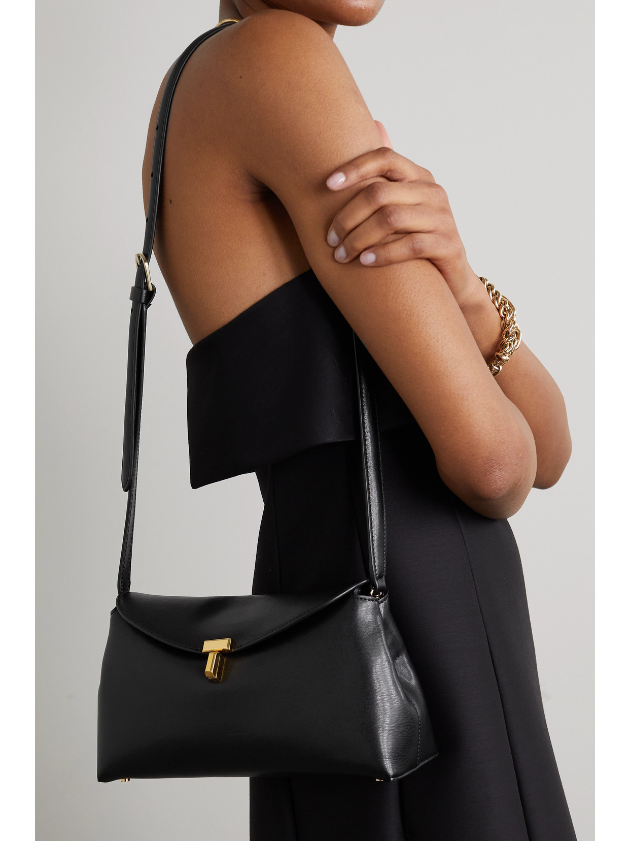 Shop Totême T-lock Leather Clutch In Black