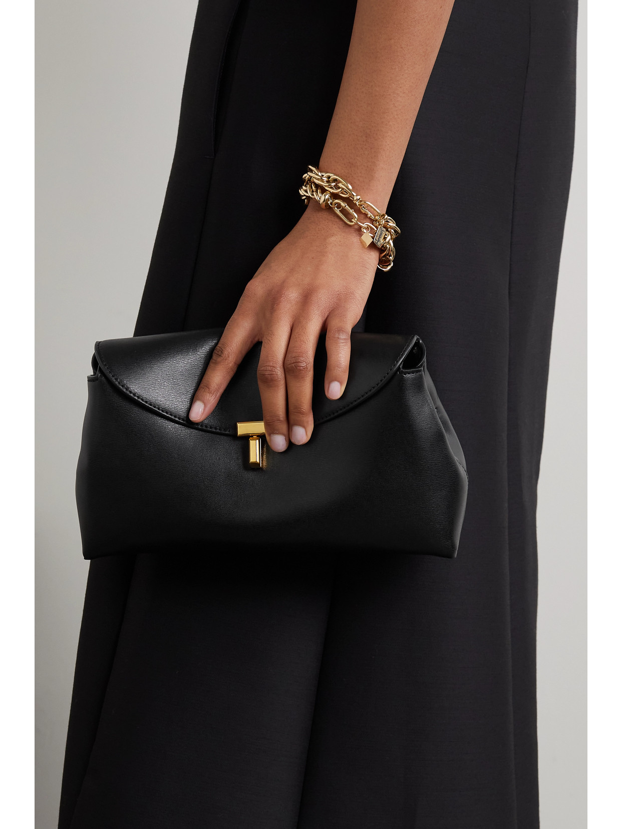 Shop Totême T-lock Leather Clutch In Black