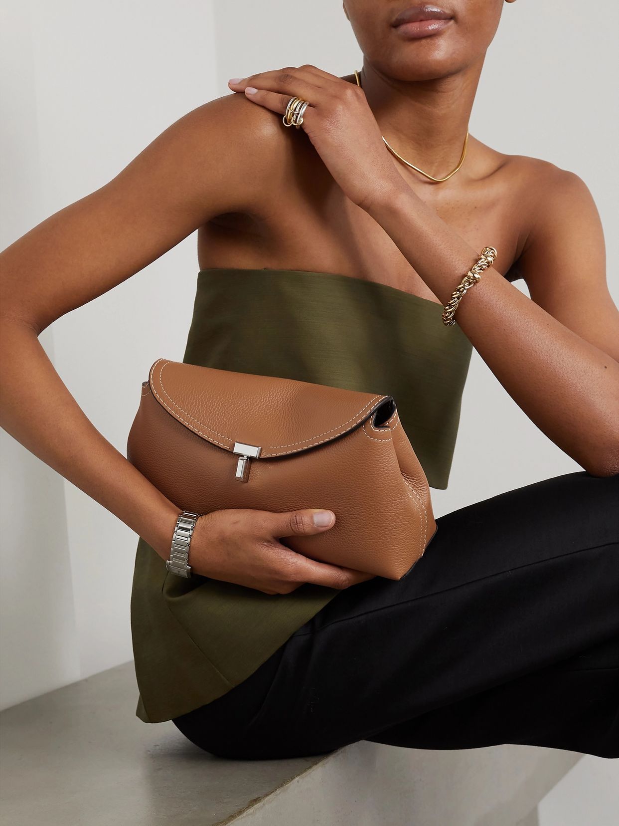 T-Lock textured-leather clutch | 토템 | FETCHING