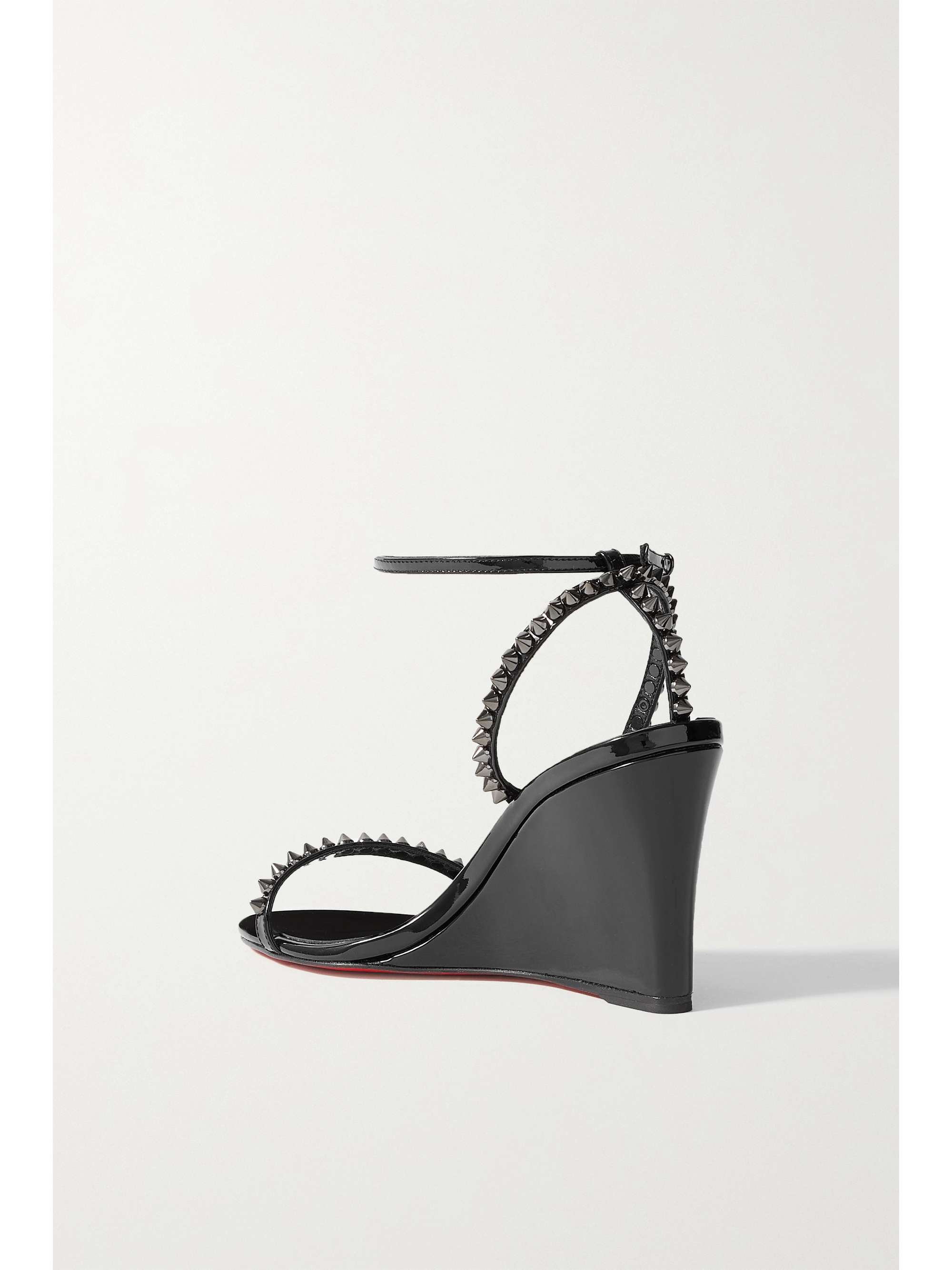 CHRISTIAN LOUBOUTIN Sandales compensées en cuir verni à clous So Me 85