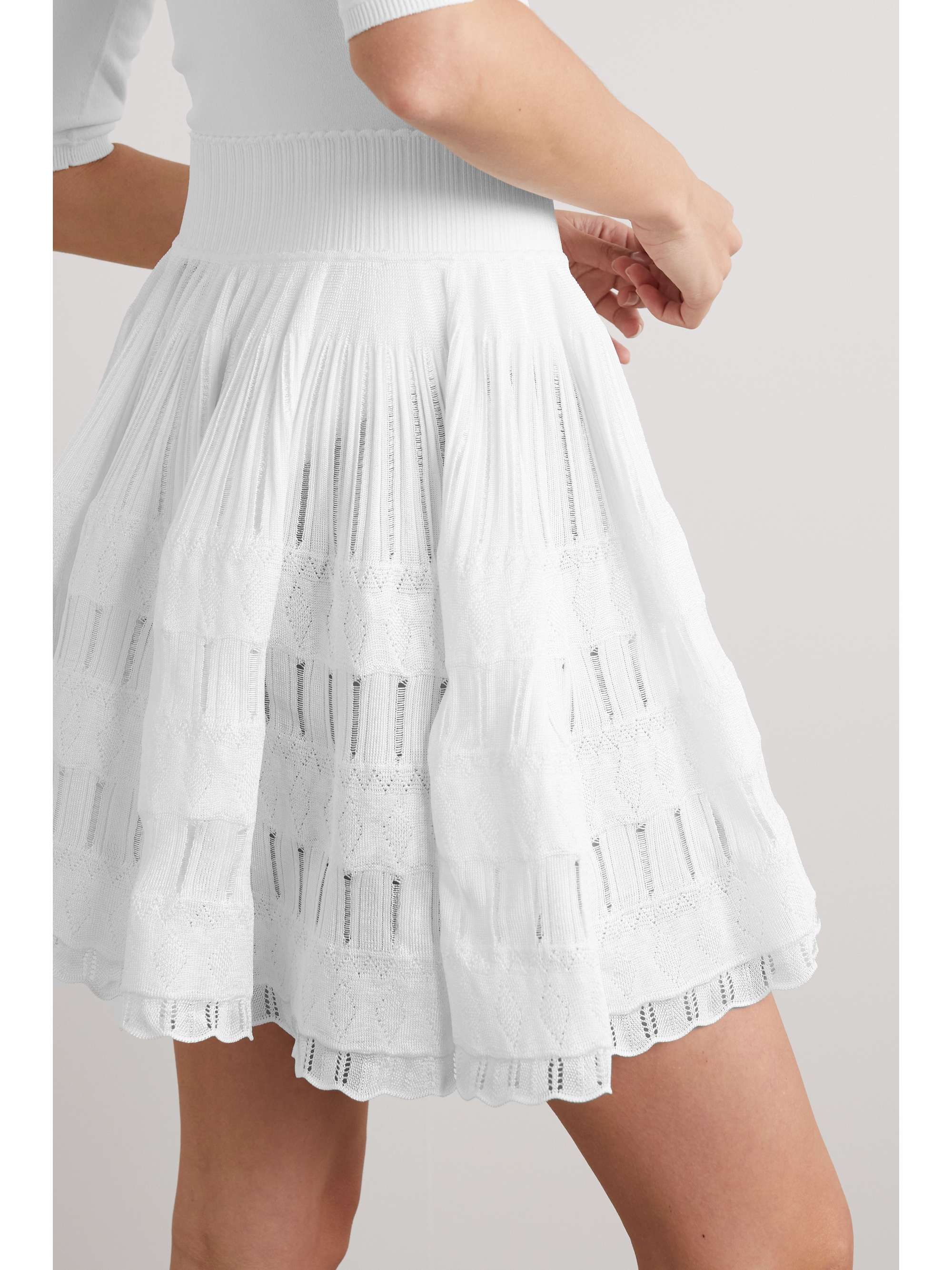 ALAÏA Ruffled tiered stretchknit mini skirt NETAPORTER