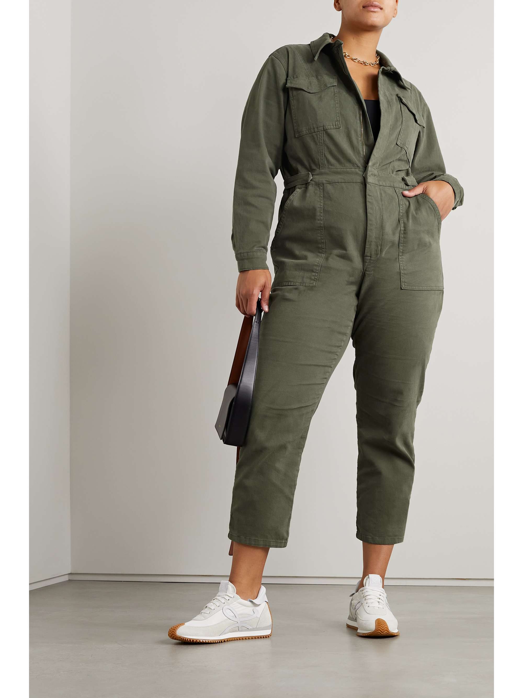 GOOD AMERICAN's co-founders Khloé Kardashian and Emma Grede have expanded their collection of size-inclusive jeans to incorporate pieces like this 'Fit For Success' jumpsuit. Cut from slightly stretchy 'Fern'-green denim, it has utilitarian pockets and a nipped-in waist. The cropped, straight legs work well with heels and sneakers alike.