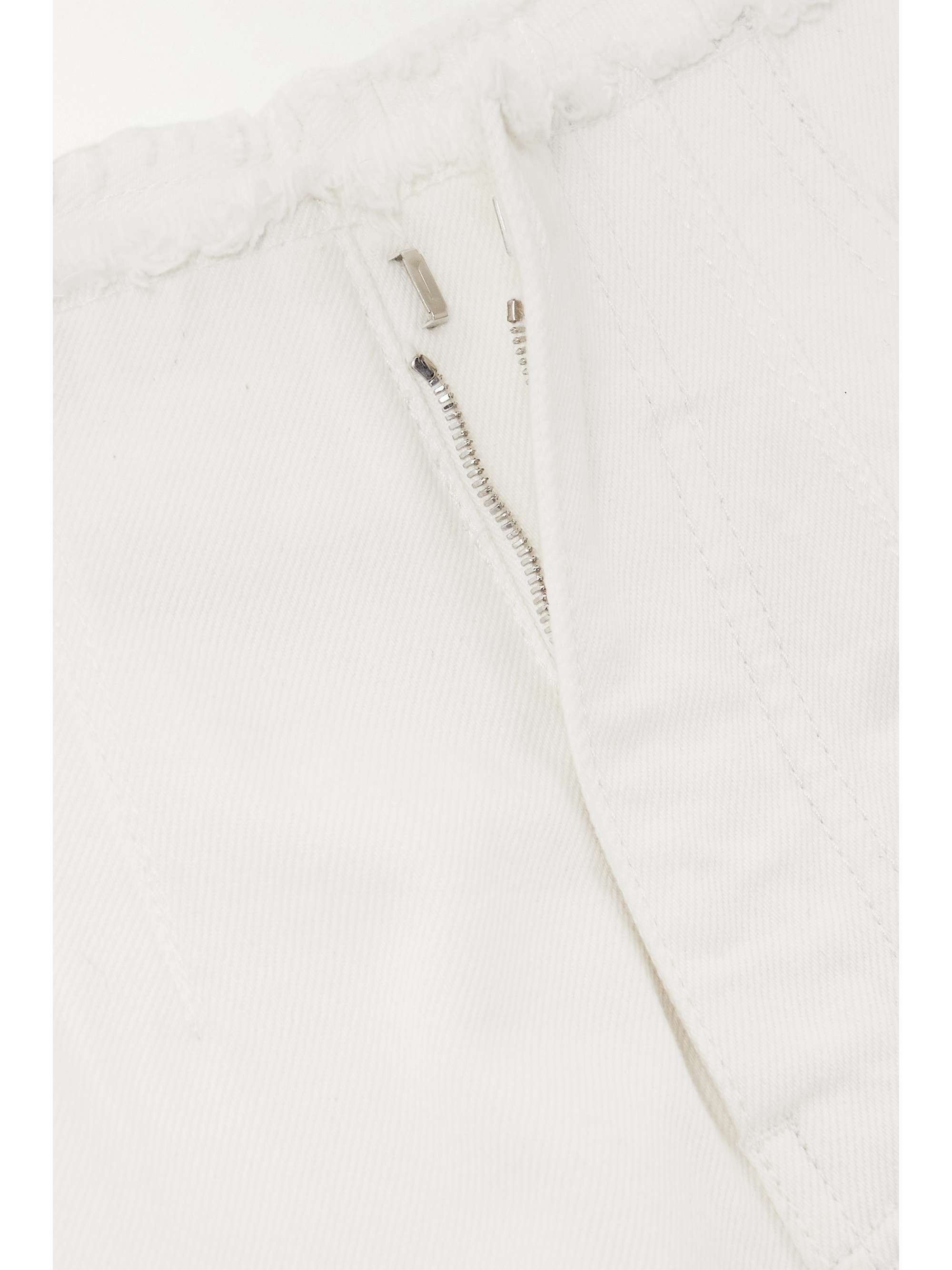 ALAÏA Embroidered laser-cut frayed low-rise jeans