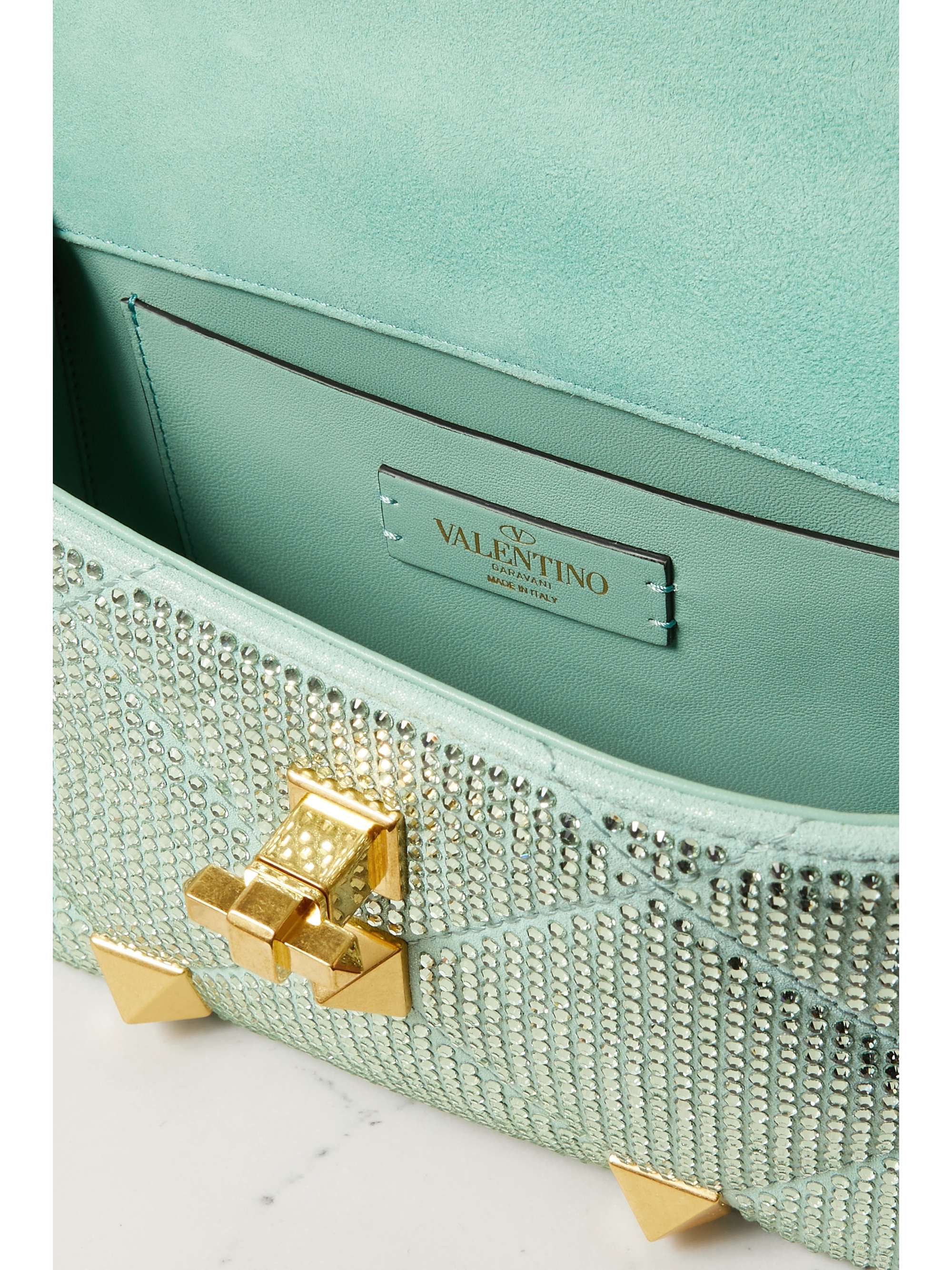 VALENTINO GARAVANI Valentino Garavani Roman Stud crystal-embellished suede shoulder bag