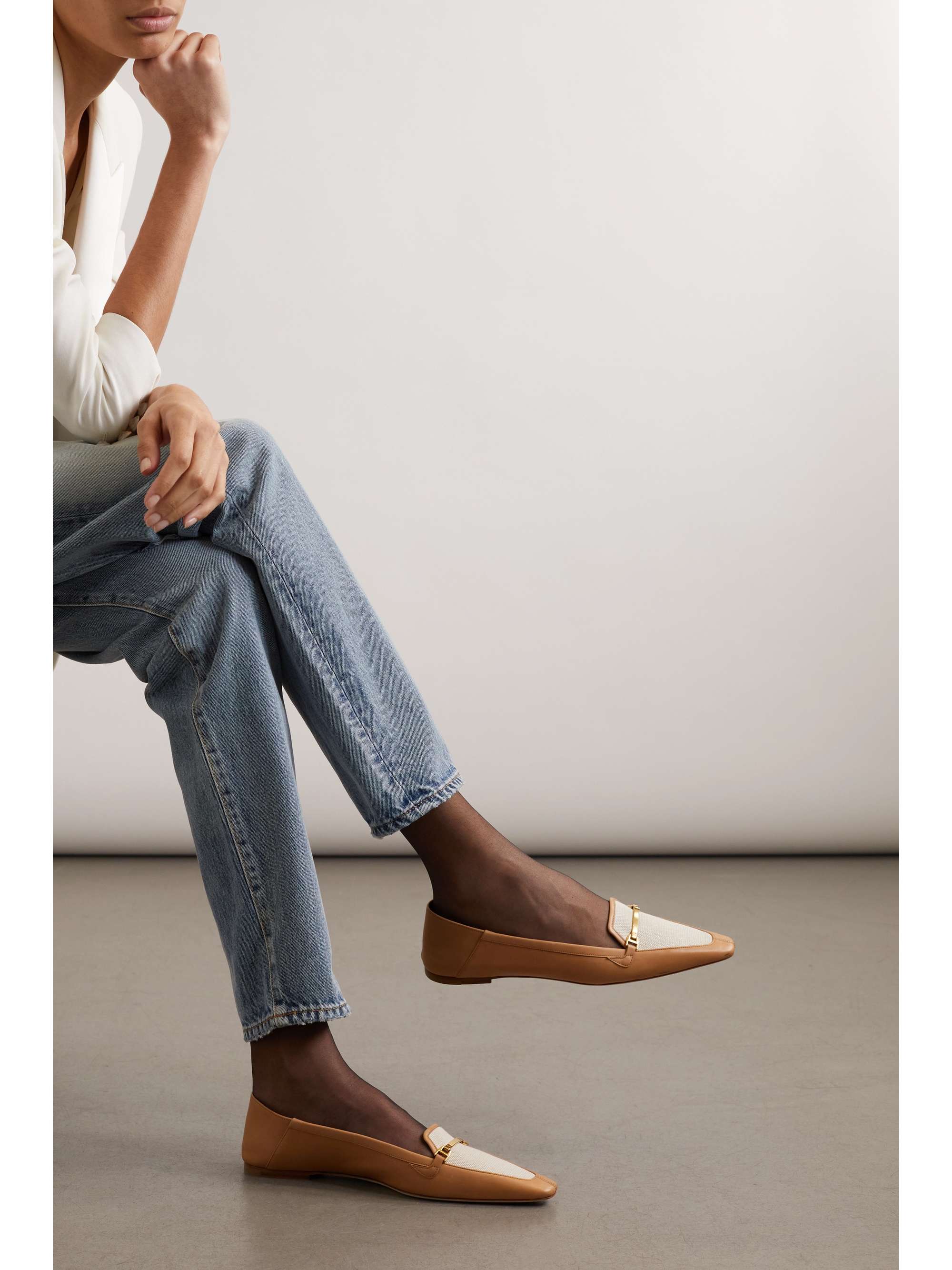 SAINT LAURENT Two-tone embellished leather loafers
