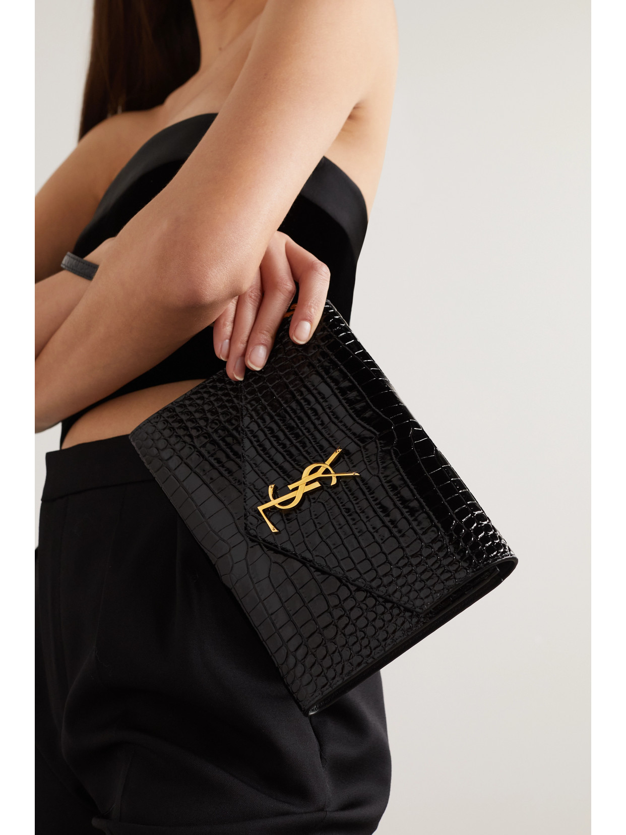 Shop Saint Laurent Glossed Croc-effect Leather Clutch In Black