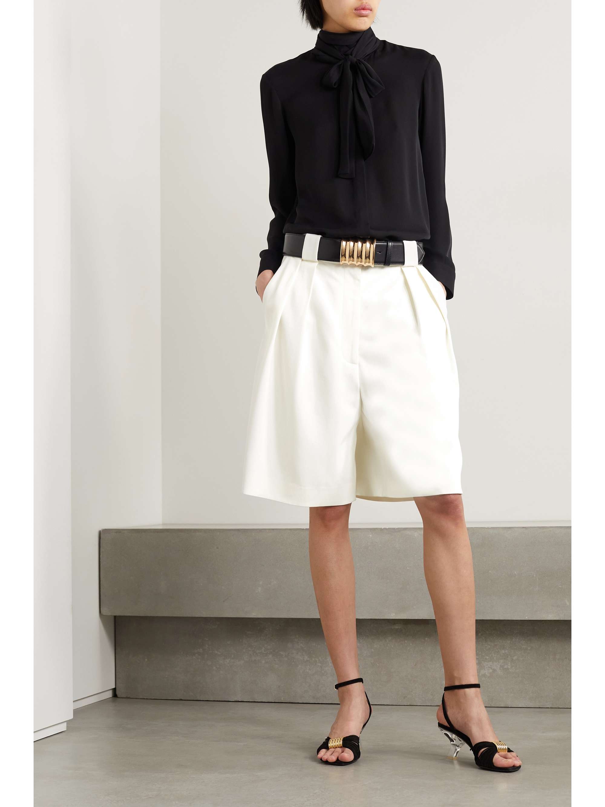 KHAITE Rillo pleated twill shorts | NET-A-PORTER