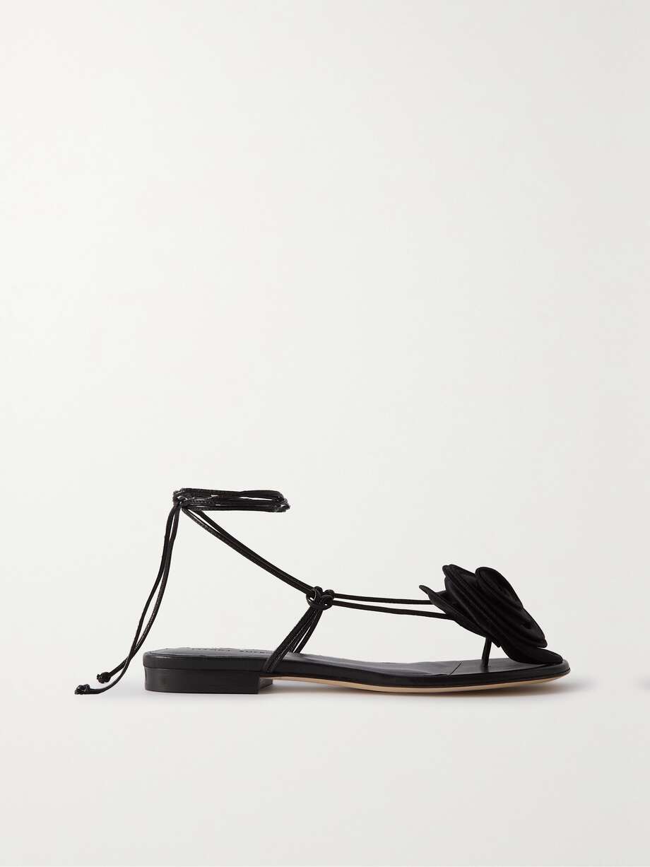 If you're hunting for eye-catching wedding guest accessories to complete your 2023 wedding guest outfit, look no further. The fashion world has fallen for Magda Butrym's signature lifelike blooms. These flat sandals are topped with a detachable satin flower influenced by vintage shoe clips and have strappy leather ties. They’re the perfect excuse for a rosy pedicure.