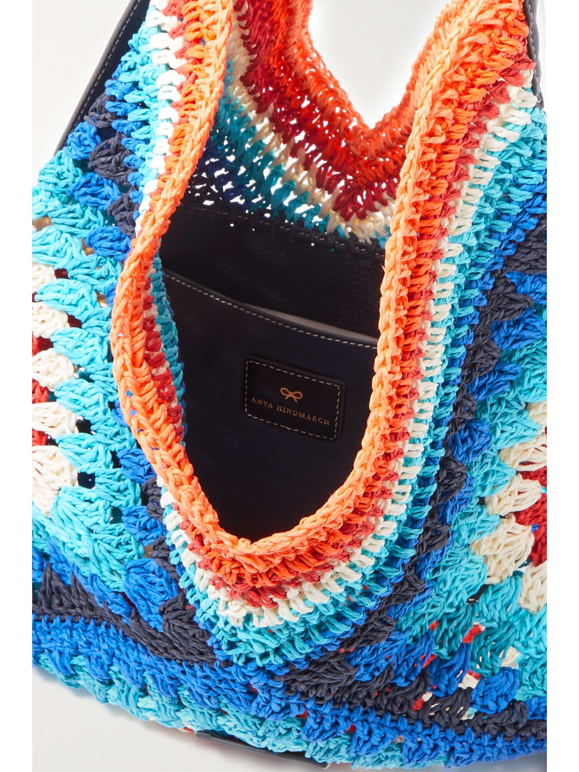 ANYA HINDMARCH Tasseled leather-trimmed crocheted raffia tote