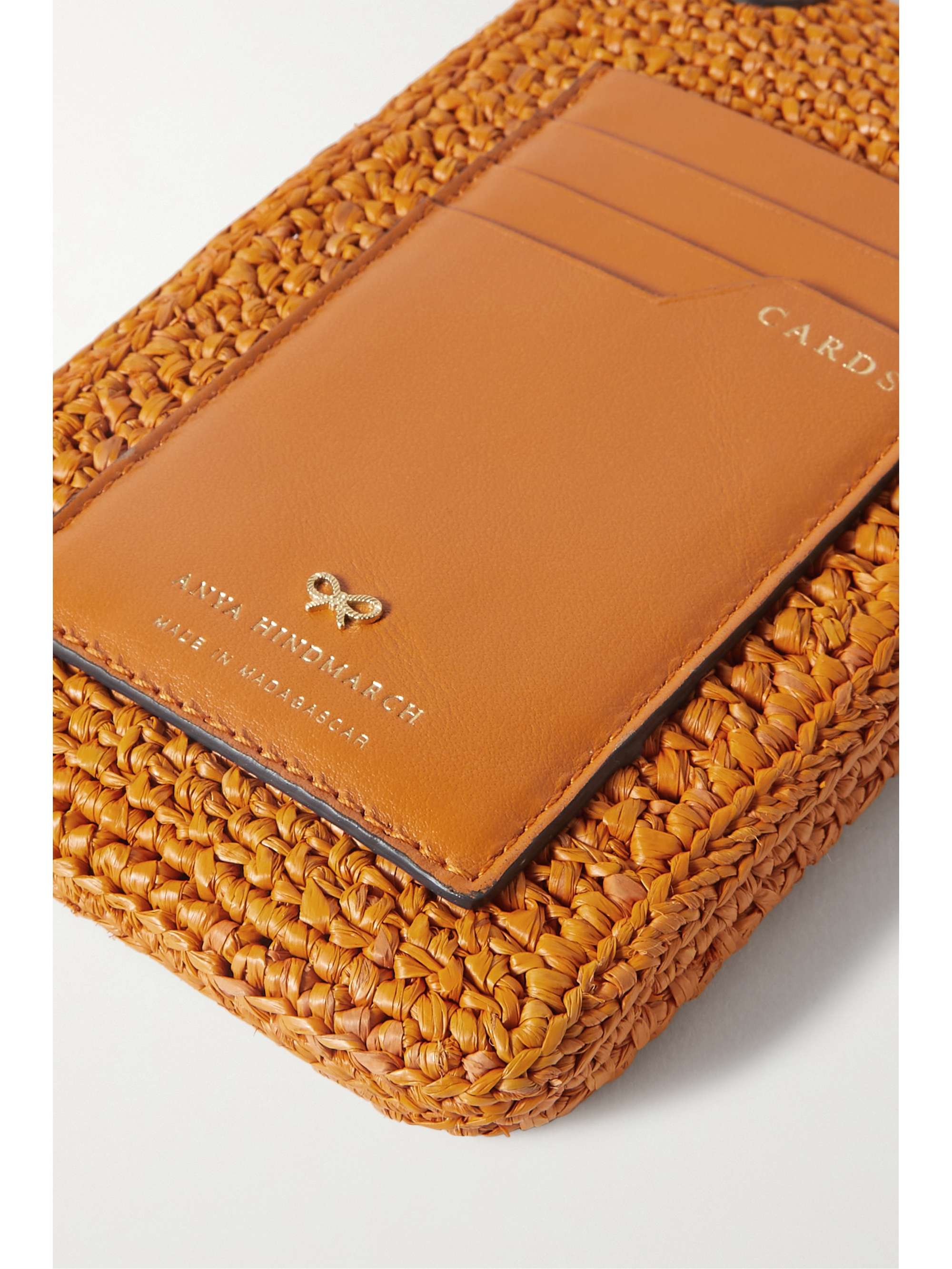 ANYA HINDMARCH Eyes embroidered leathertrimmed raffia phone case NET