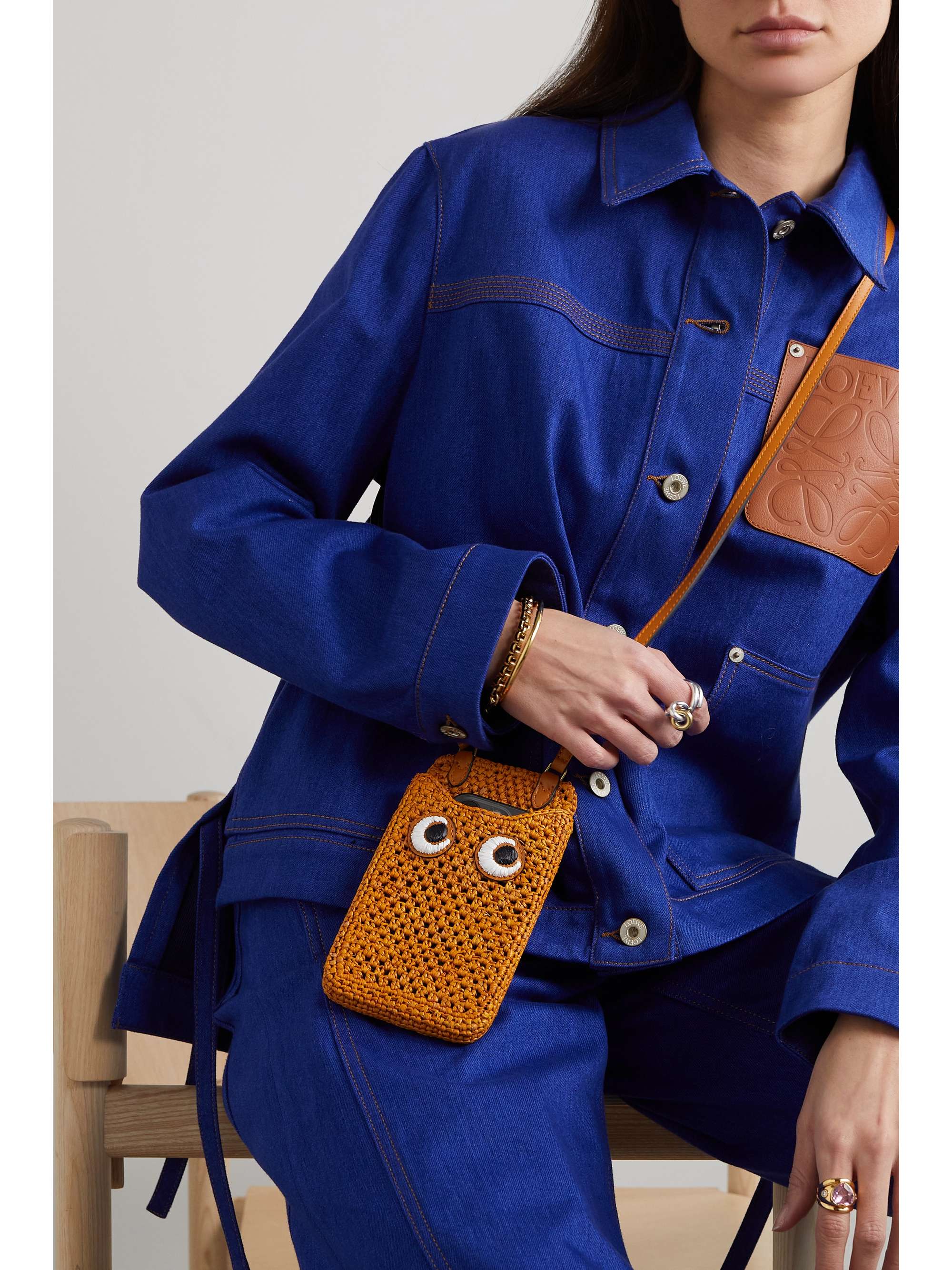 ANYA HINDMARCH Eyes embroidered leathertrimmed raffia phone case NET