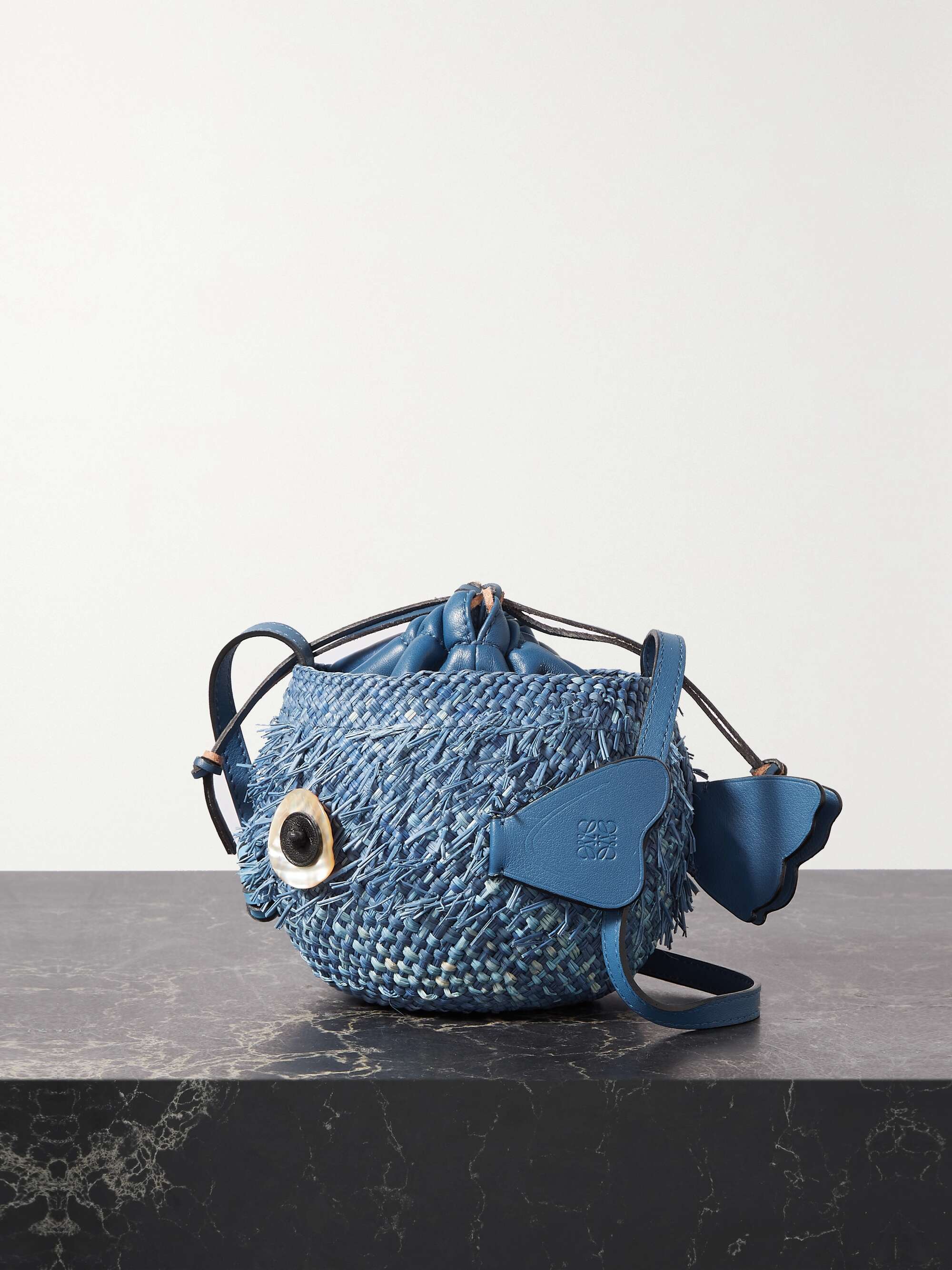 + Paula's Ibiza leather-trimmed raffia bucket bag