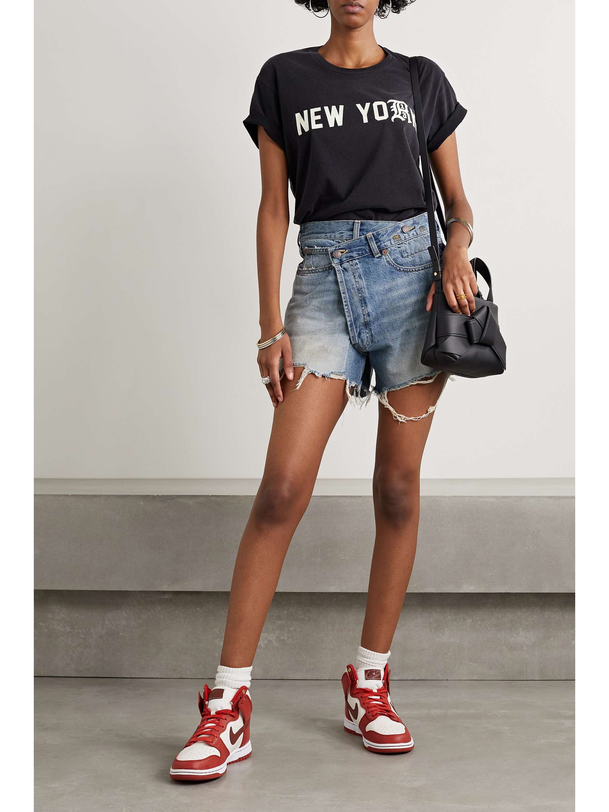 Crossover asymmetric distressed denim shorts