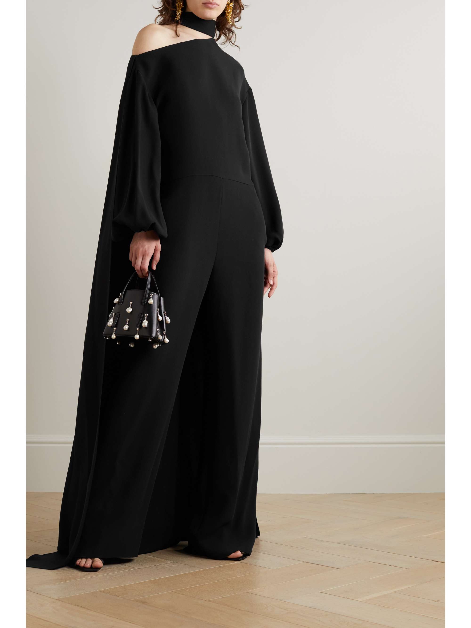Valentino Solid Jumpsuit in Nero | FWRD