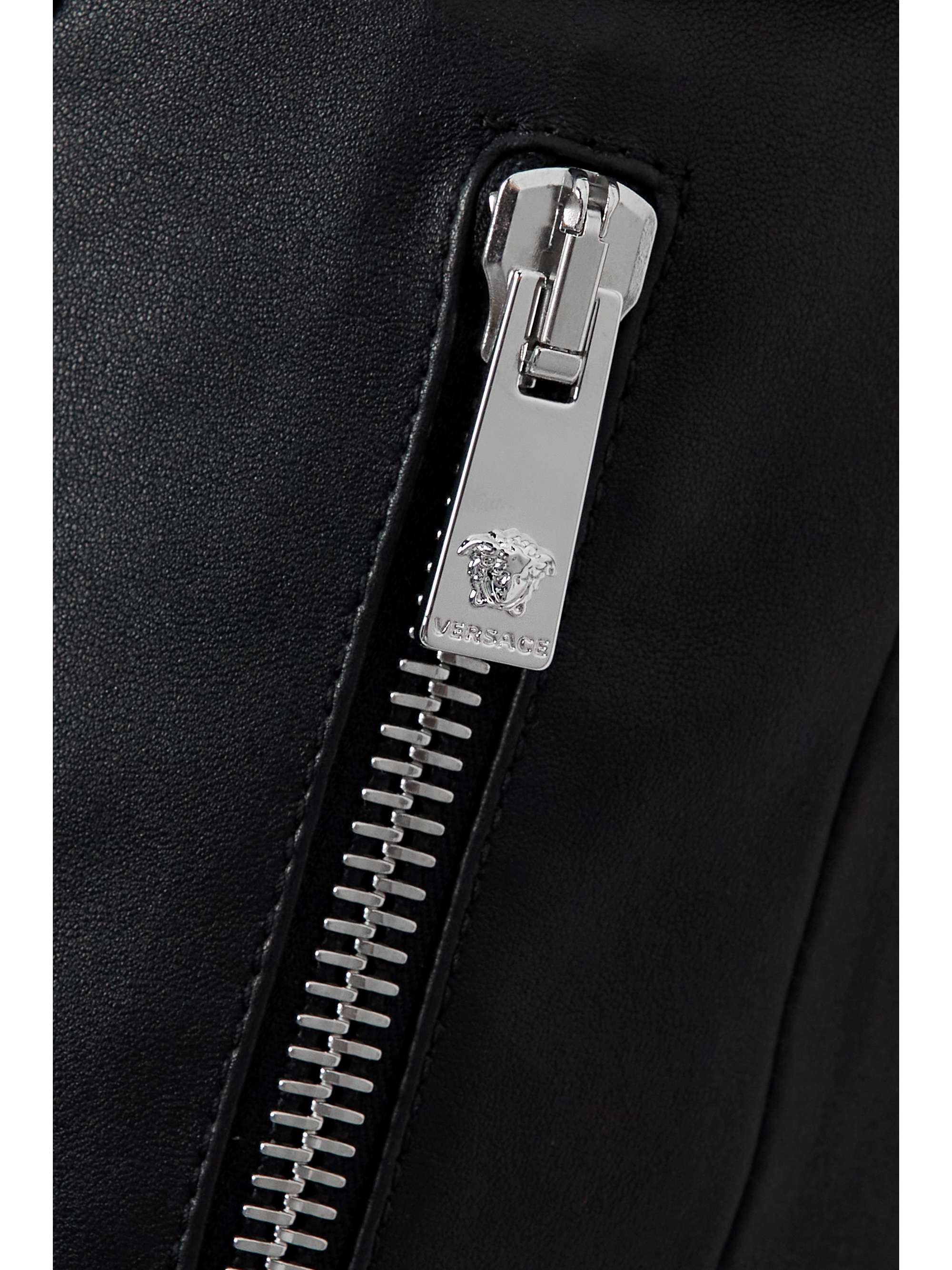 VERSACE Belted leather and denim flared pants