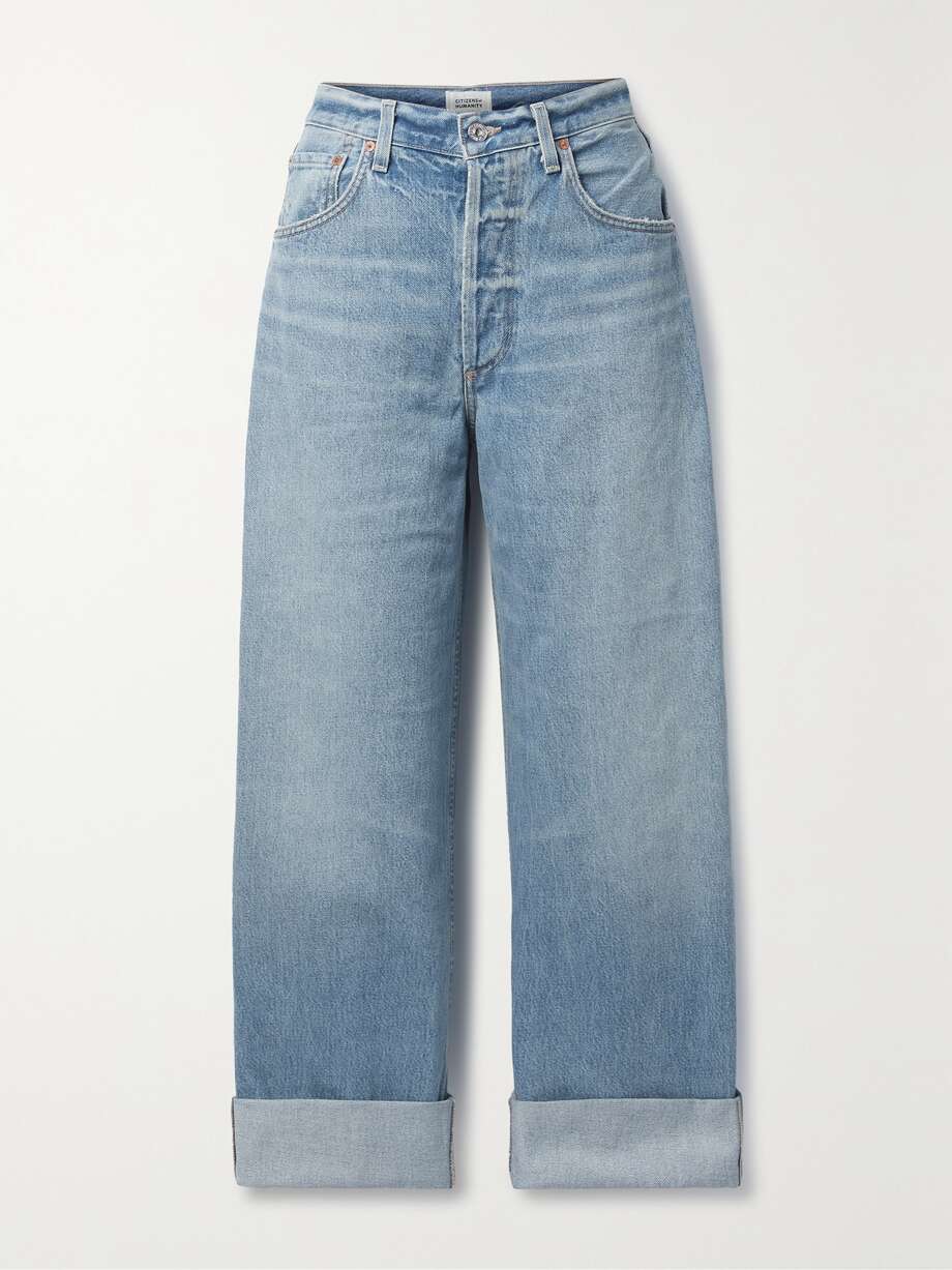 Citizens of Humanity's 'Ayla' jeans are made from faded and whiskered light-blue organic denim contrasted by gold topstitching. They're designed in a classic five-pocket construction and have a high-rise waist and wide legs that you can roll at the cuffs.