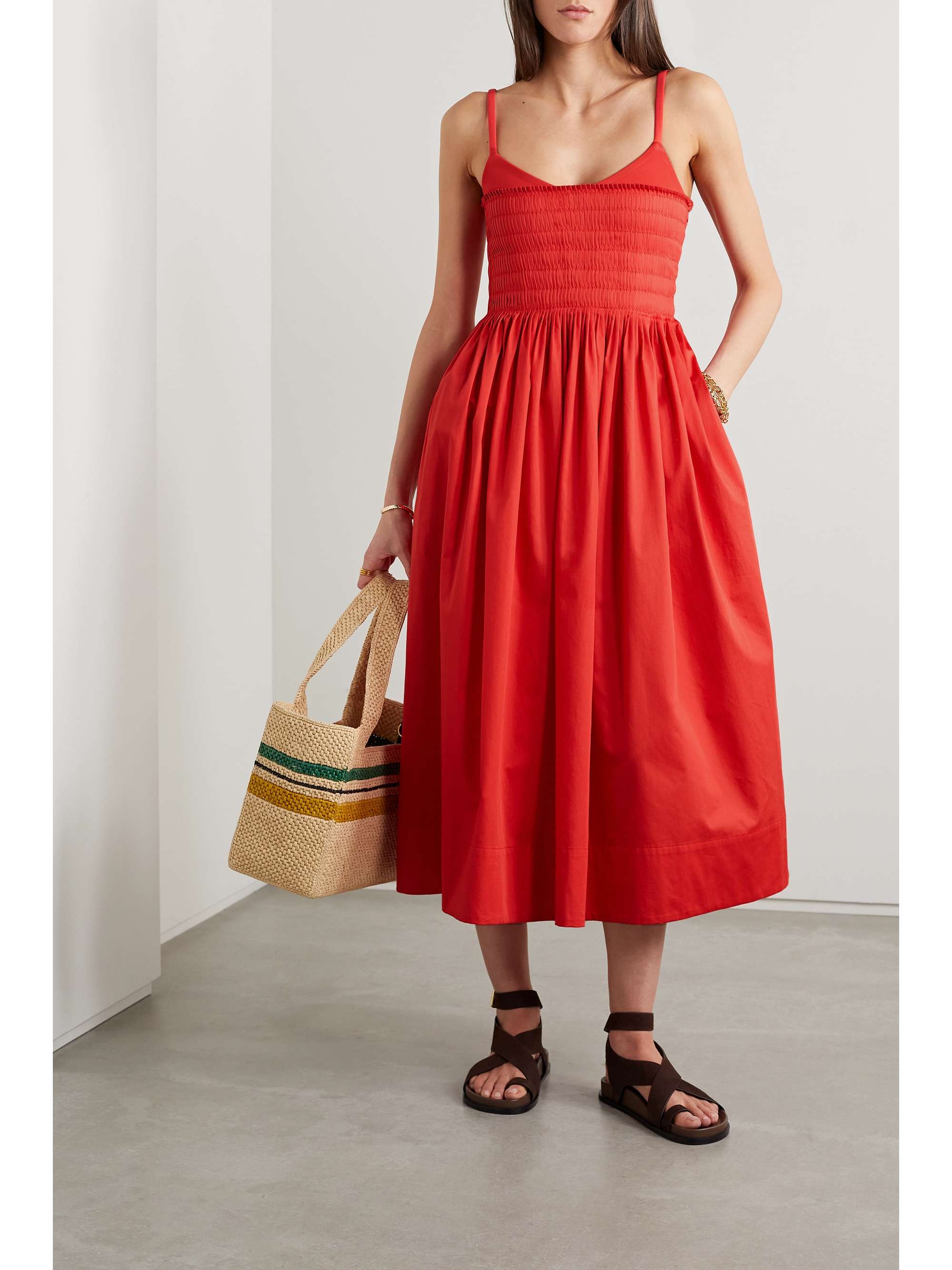 La Ligne's dress is intricately pintucked along the bodice before flaring out to a voluminous midi skirt. It's made from lightweight cotton-poplin and has tonal stretch-jersey along the neckline. Wear yours with sandals or sneakers.