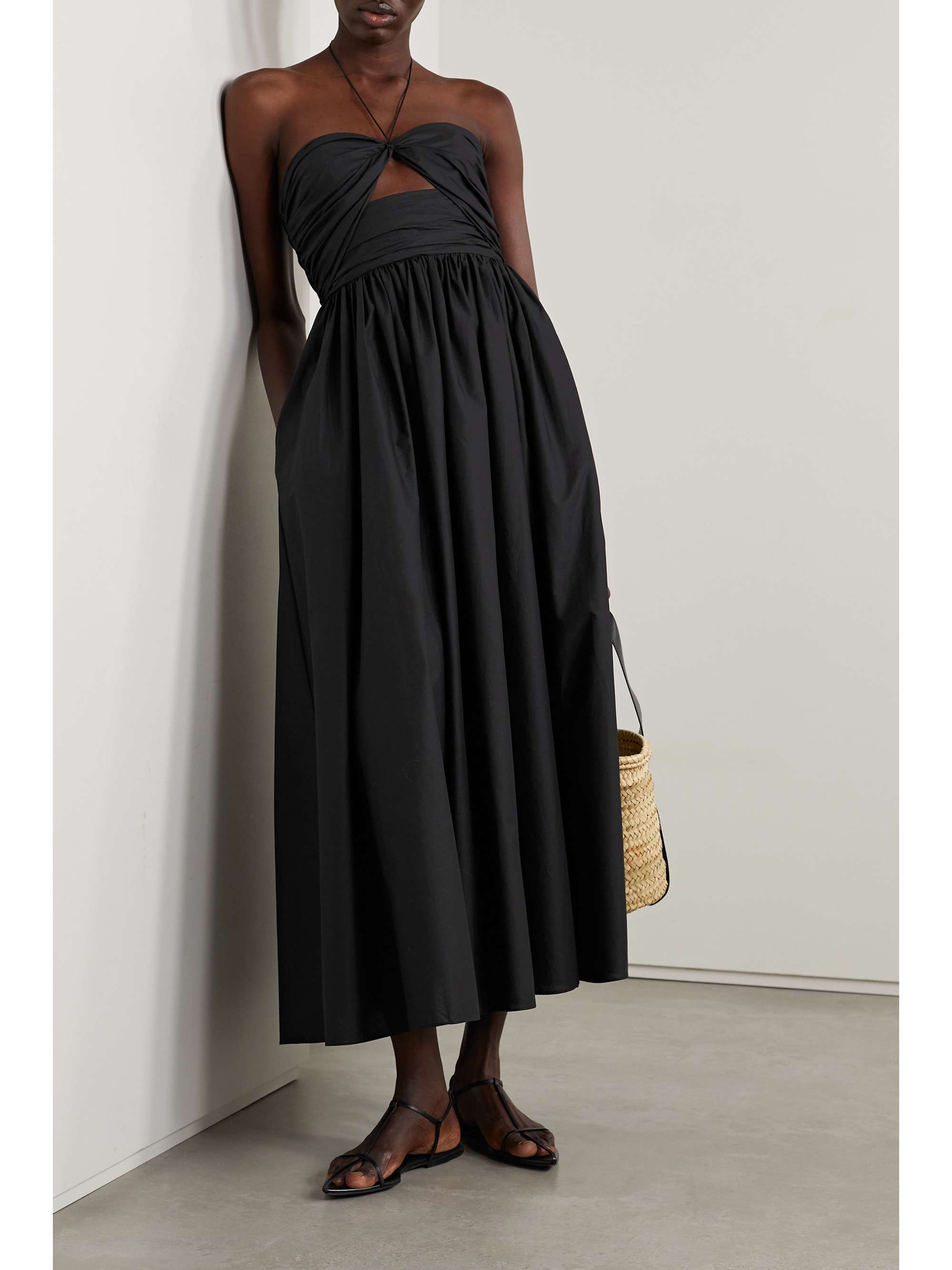 Matteau's dress is just as suited for dinner or daytime sight-seeing. It's made from organic cotton-poplin that's gathered through the cutout bodice and has a floaty, gently pleated skirt and slim halterneck straps. Wear yours with strappy sandals and a woven bag.