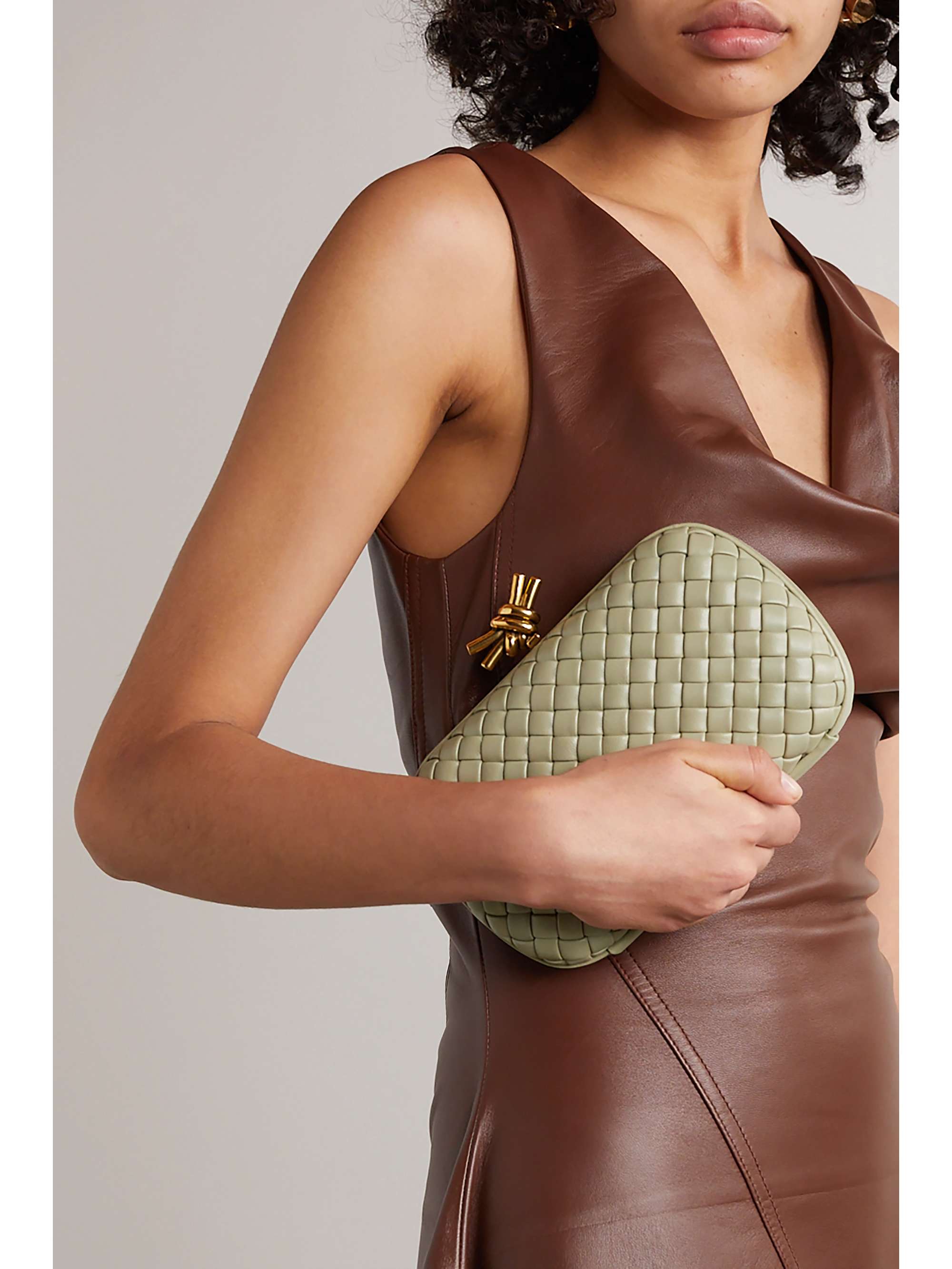 Knot padded intrecciato leather clutch