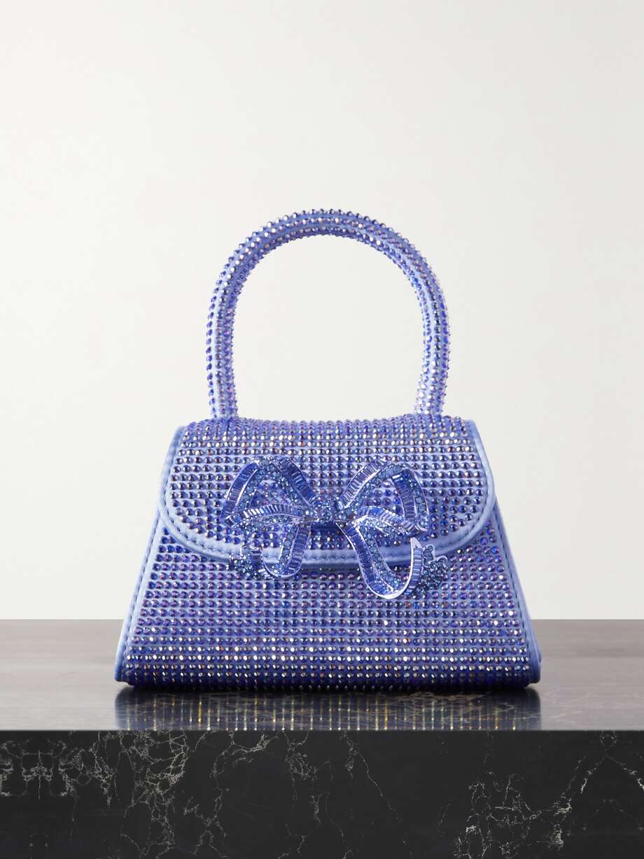 Self-Portrait's tote is covered in iridescent crystals, from the top handle to the sweet bow embellishment. It's made from silk in a structured, micro shape that only has space for your cards and lipstick. Attach the chain strap to go hands-free.