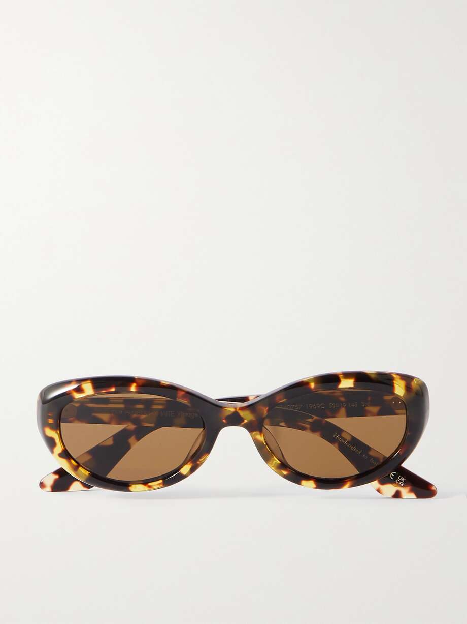 A key contender for your summer capsule wardrobe, EXCLUSIVE AT NET-A-PORTER. Inspired by vintage styles, Oliver Peoples' '1969' sunglasses are distinguished by their oval frames and slim arms. Part of the brand's collaboration with New York-based label, Khaite, they debuted on the latter's Summer '23 runway. Embrace the retro mood and wear yours as part of a monochrome outfit, as styled in the show.